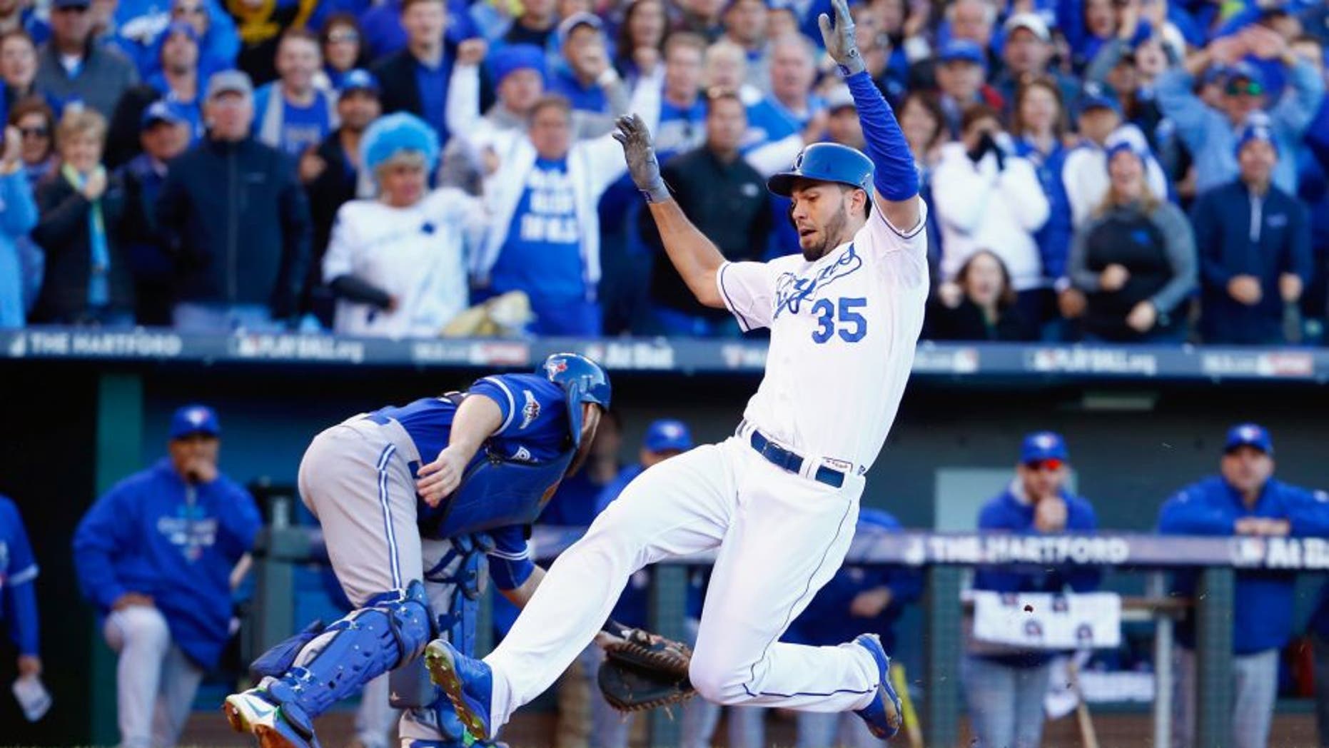 Eric Hosmer #35 of the Kansas City Royals scores a run in the seventh inning against the Toronto Blue Jays in game two of the American League Championship Series at Kauffman Stadium on October 17, 2015 in Kansas City, Missouri. (Photo by Jamie Squire/Getty Images)
