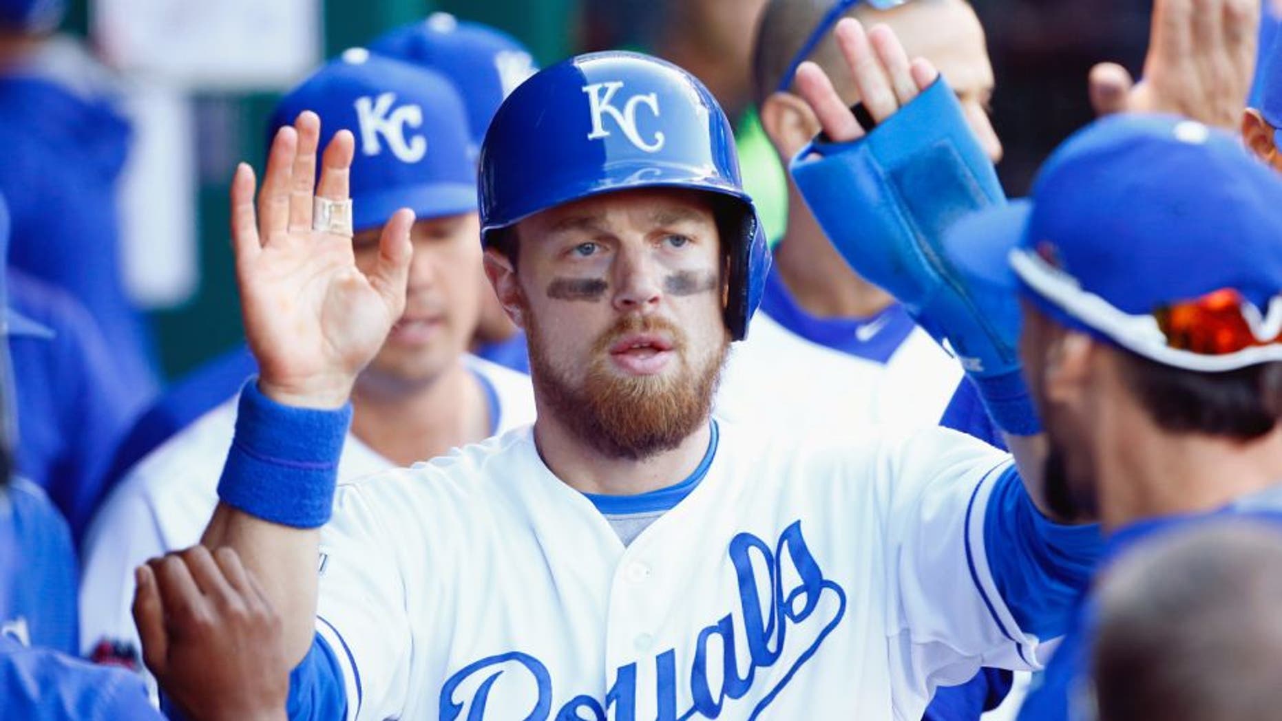 Ben Zobrist #18 of the Kansas City Royals celebrates in the dugout after scoring a run in the seventh inning against the Toronto Blue Jays in game two of the American League Championship Series at Kauffman Stadium on October 17, 2015 in Kansas City, Missouri. (Photo by Jamie Squire/Getty Images)