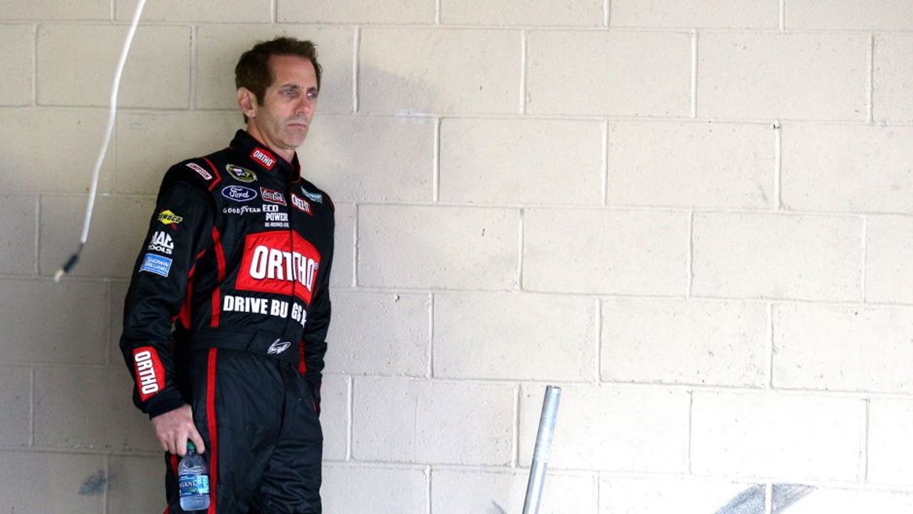 DOVER, DE - OCTOBER 03: Greg Biffle, driver of the #16 Ortho Ford, looks on in the garage area during practice for the NASCAR Sprint Cup Series AAA 400 at Dover International Speedway on October 3, 2015 in Dover, Delaware. (Photo by Patrick Smith/Getty Images)