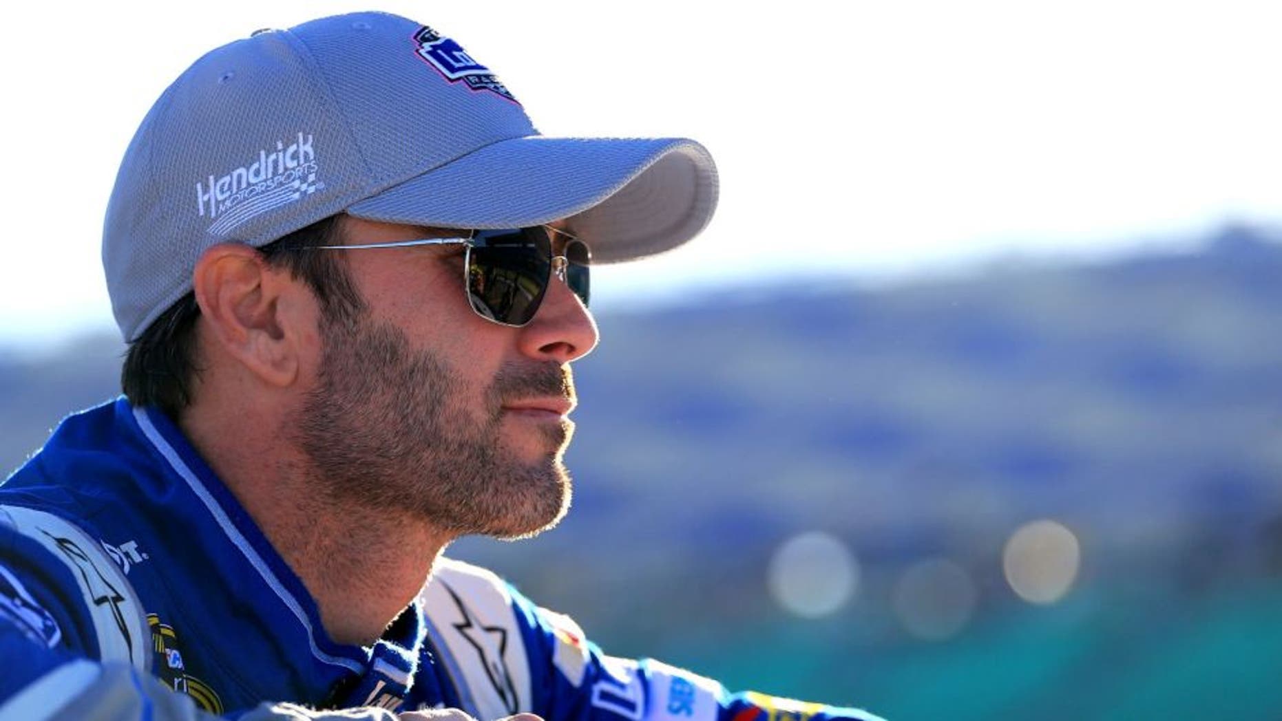 KANSAS CITY, KS - OCTOBER 16: Jimmie Johnson, driver of the #48 Lowe's Chevrolet, looks on during qualifying for the NASCAR Sprint Cup Series Hollywood Casino 400 at Kansas Speedway on October 16, 2015 in Kansas City, Kansas. (Photo by Daniel Shirey/Getty Images)