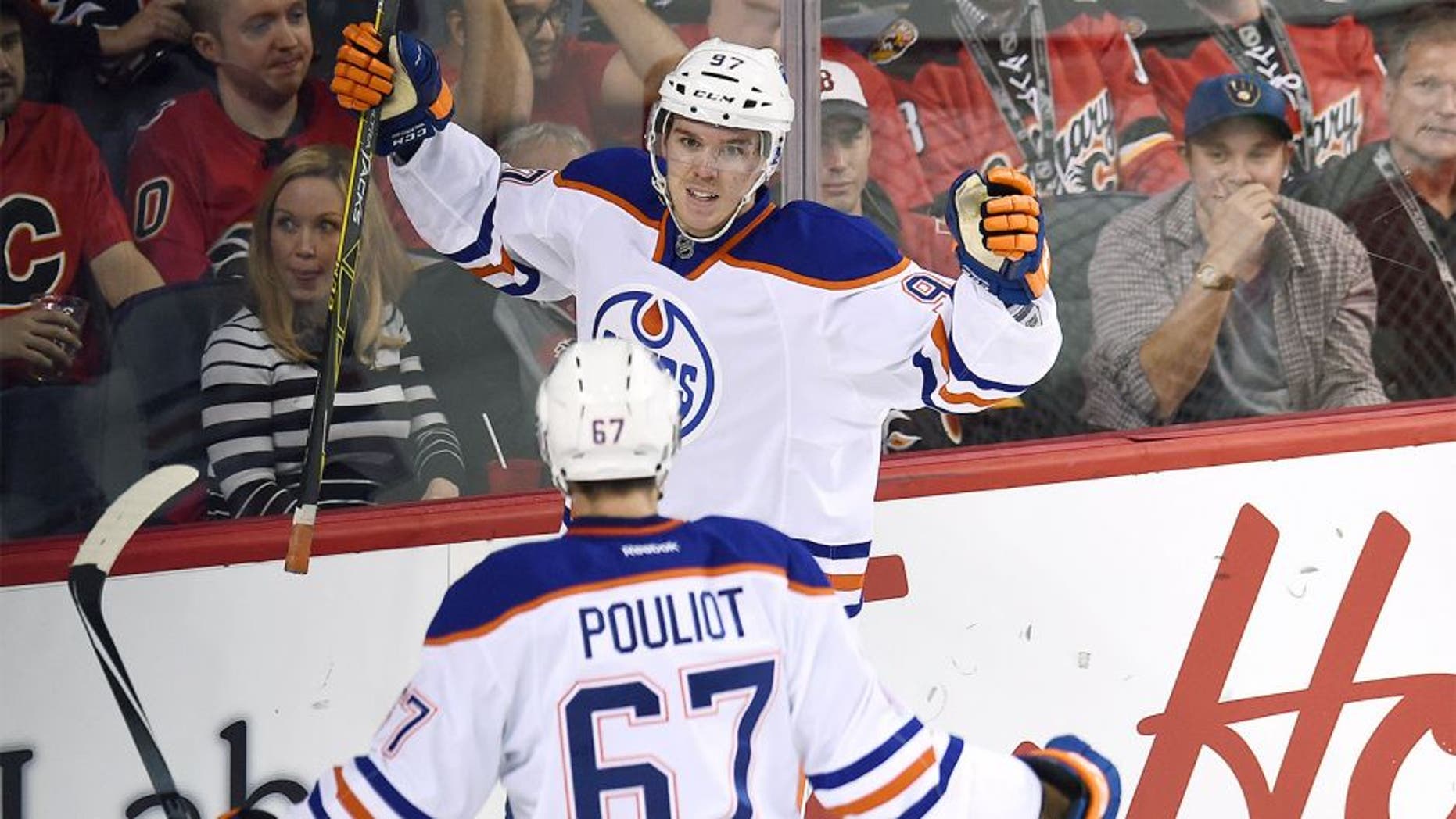 Oct 17, 2015; Calgary, Alberta, CAN; Edmonton Oilers center Connor McDavid (97) celebrates his second period goal against the Calgary Flames at Scotiabank Saddledome. Mandatory Credit: Candice Ward-USA TODAY Sports