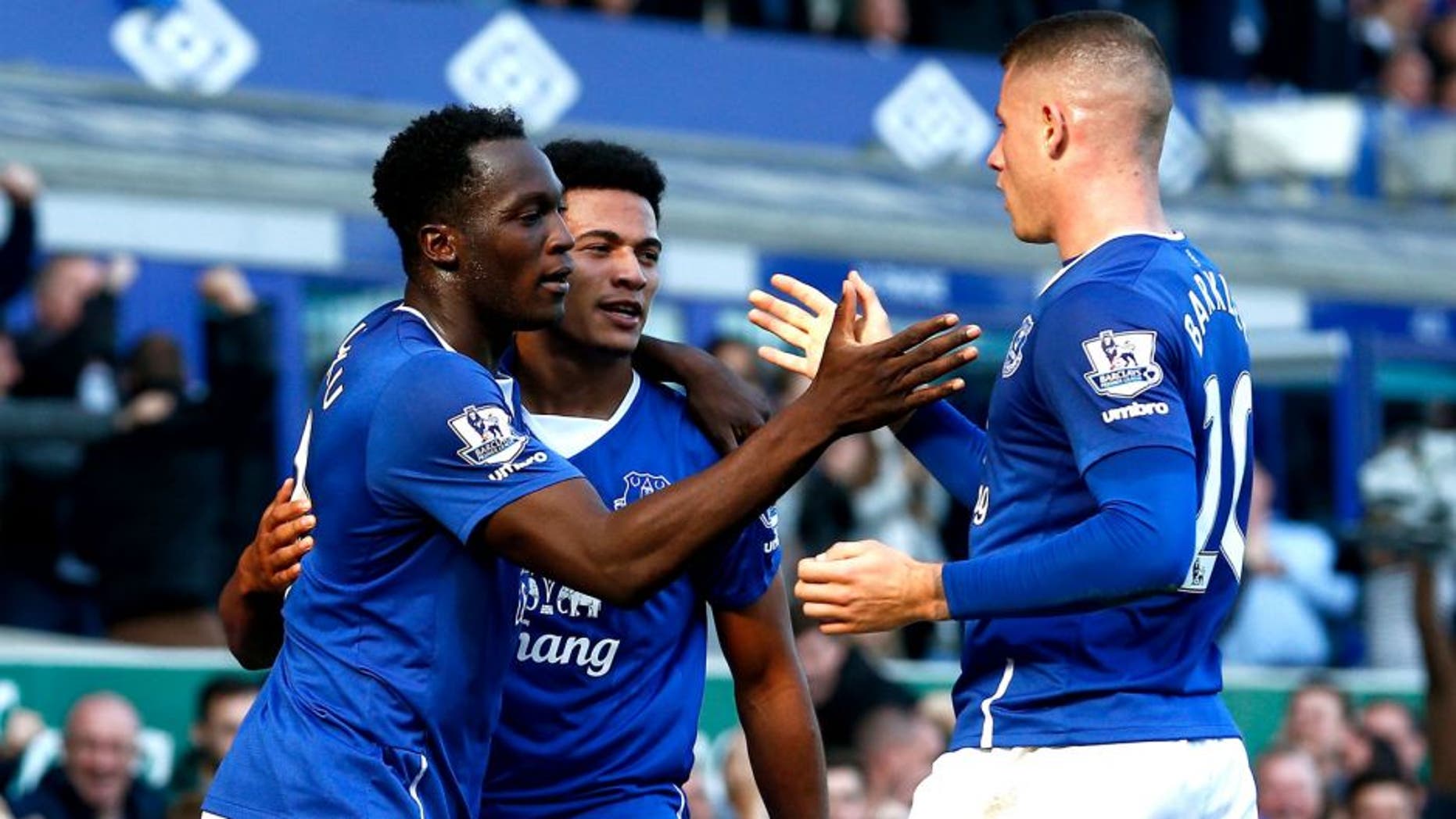 LIVERPOOL, ENGLAND - OCTOBER 04: Romelu Lukaku (L) of Everton celebrates with Tyias Browning (C) of Everton and Ross Barkley (R) of Everton after scoring Everton's first goal during the Barclays Premier League match between Everton and Liverpool at Goodison Park on October 4, 2015 in Liverpool, England. (Photo by Dean Mouhtaropoulos/Getty Images)