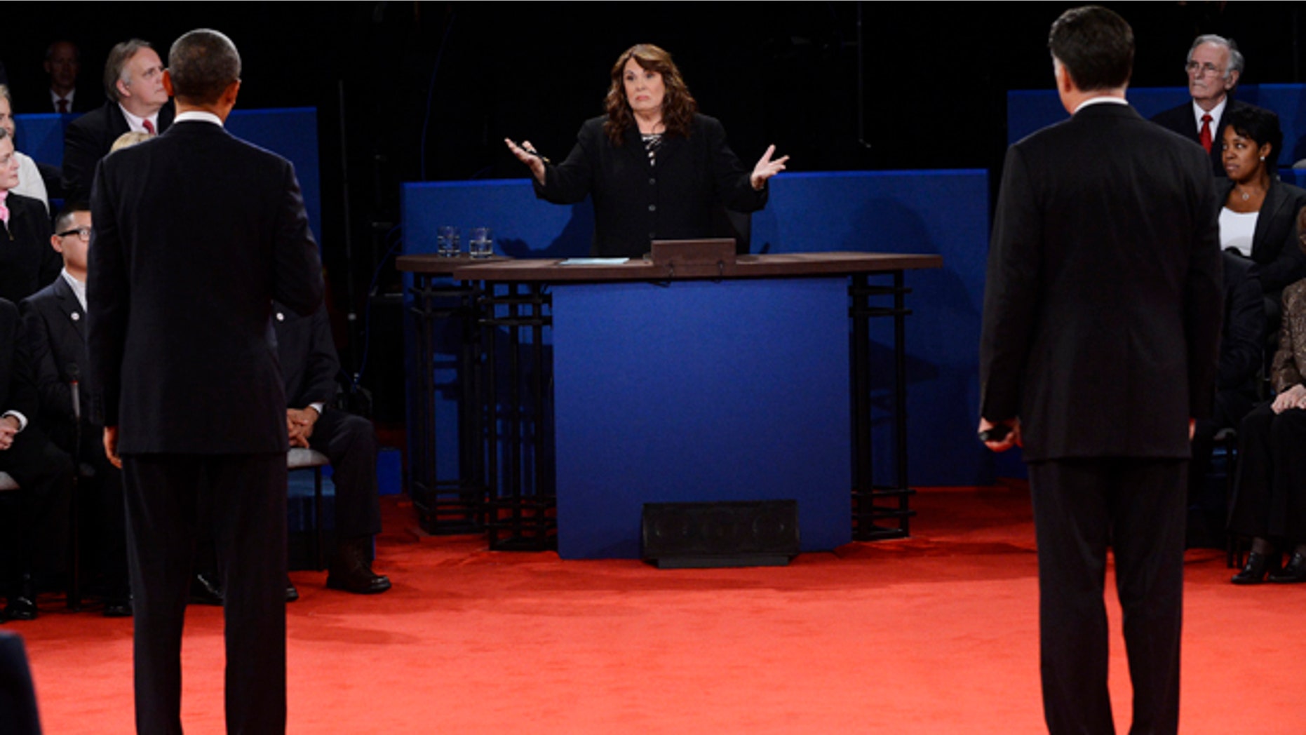 Oct. 16, 2012: Moderator Candy Crowley, center, addresses President Barack Obama, left, and Republican presidential nominee Mitt Romney during the second presidential debate.