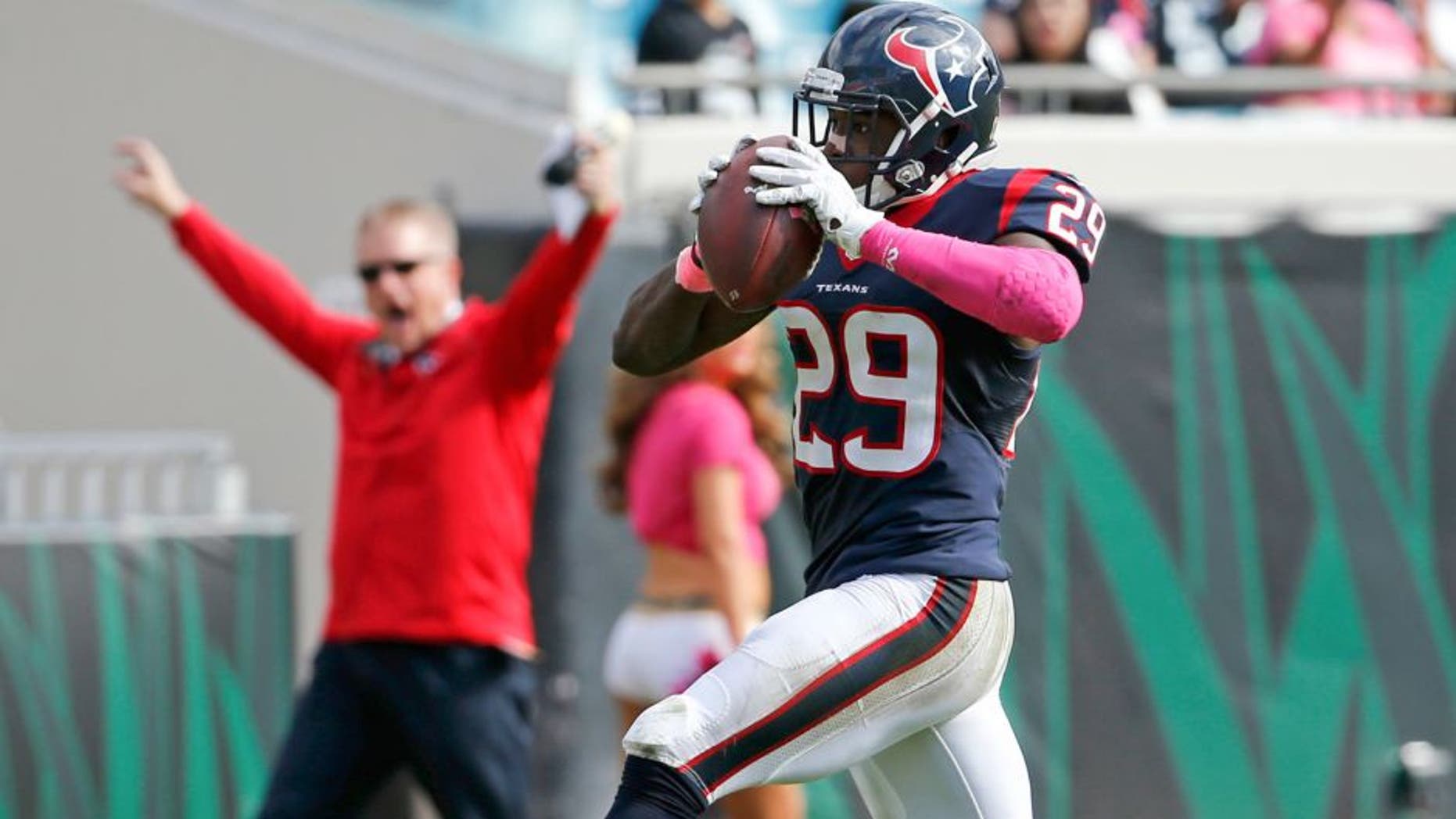Houston Texans defensive back Andre Hal (29) returns an interception 31-yards for a touchdown against the Jacksonville Jaguars during the second half of an NFL football game in Jacksonville, Fla., Sunday, Oct. 18, 2015. (AP Photo/Stephen B. Morton)