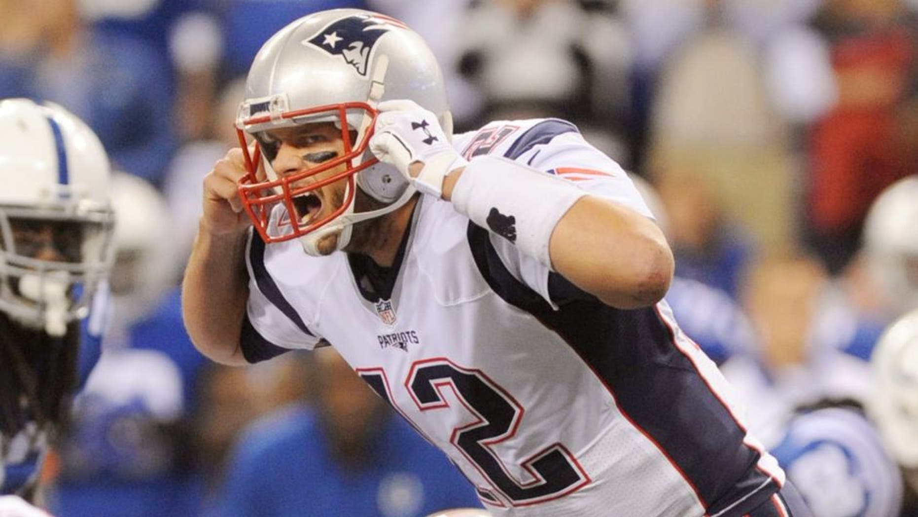 Oct 18, 2015; Indianapolis, IN, USA; New England Patriots quarterback Tom Brady (12) calls out at the line against the Indianapolis Colts in the first half during the NFL game at Lucas Oil Stadium. Mandatory Credit: Thomas J. Russo-USA TODAY Sports