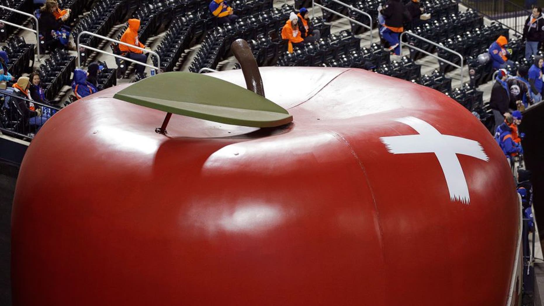 The giant apple in center field of Citi Field is seen with a bandage on it after a home run in the first game of National League baseball championship series between the New York Mets and the Chicago Cubs Sunday, Oct. 18, 2015, in New York. (AP Photo/Julie Jacobson)