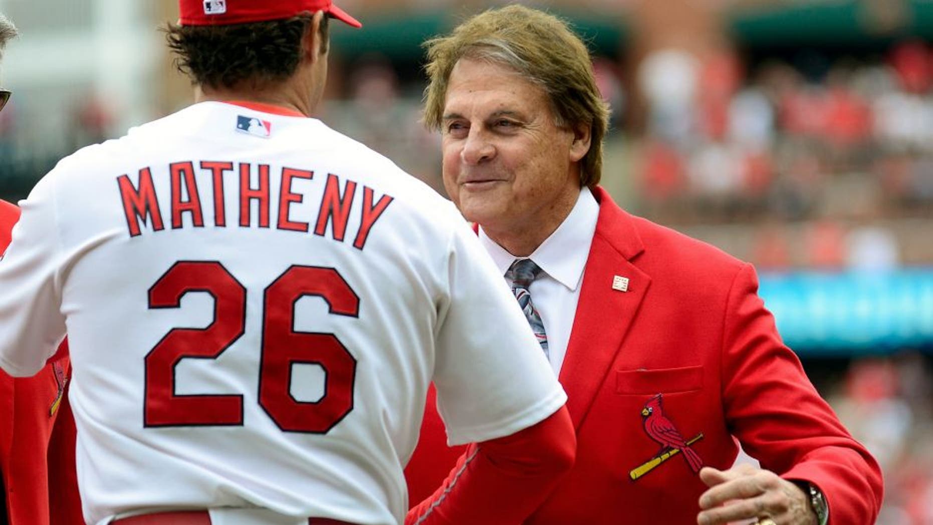 ST. LOUIS, MO - APRIL 13: Former St. Louis Cardinals manager Tony La Russa greets manager Mike Matheny #26 before a game against the Milwaukee Brewers at Busch Stadium on April 13, 2015 in St. Louis, Missouri. (Photo by Jeff Curry/Getty Images)