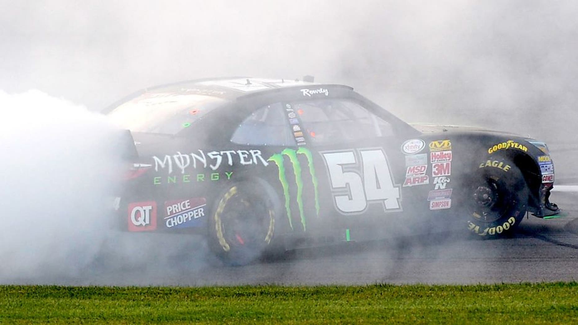 KANSAS CITY, KS - OCTOBER 17: Kyle Busch, driver of the #54 Monster Energy Toyota, celebrates with a burnout after winning the NASCAR XFINITY Series Kansas Lottery 300 at Kansas Speedway on October 17, 2015 in Kansas City, Kansas. (Photo by Robert Laberge/NASCAR via Getty Images)