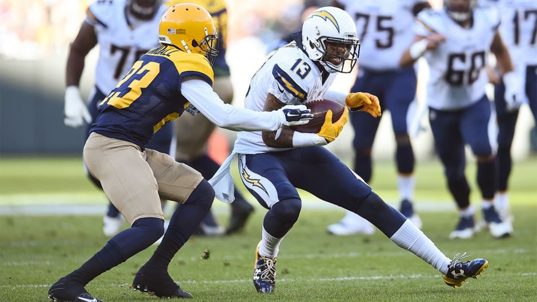 GREEN BAY, WI - OCTOBER 18: Keenan Allen #13 of the San Diego Chargers carries the football against Damarious Randall #23 of the Green Bay Packers in the second quarter at Lambeau Field on October 18, 2015 in Green Bay, Wisconsin. (Photo by Stacy Revere/Getty Images)
