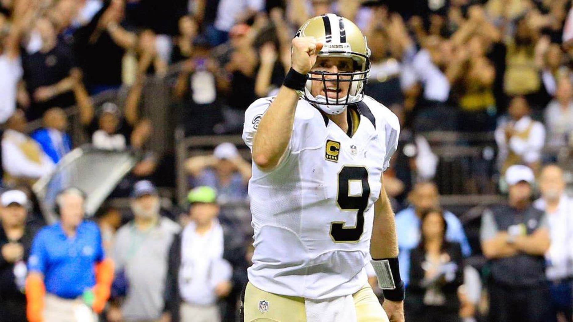Oct 15, 2015; New Orleans, LA, USA; New Orleans Saints quarterback Drew Brees (9) celebrates after a touchdown run by running back Mark Ingram (not pictured) during the fourth quarter of a game at the Mercedes-Benz Superdome. Mandatory Credit: Derick E. Hingle-USA TODAY Sports