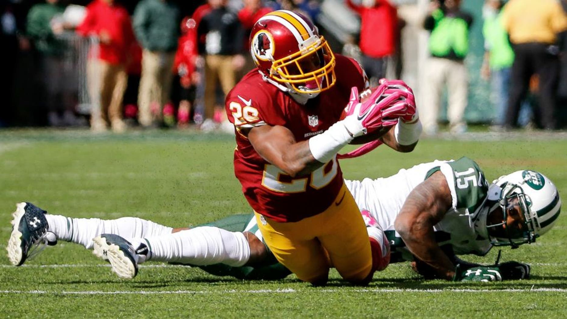 Oct 18, 2015; East Rutherford, NJ, USA; Washington Redskins cornerback Bashaud Breeland (26) intercepts a pass in the second quarter against the New York Jets at MetLife Stadium. Mandatory Credit: Vincent Carchietta-USA TODAY Sports