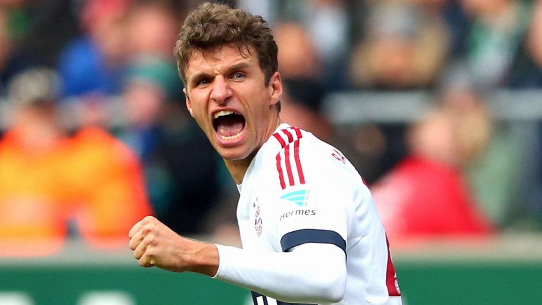 BREMEN, GERMANY - OCTOBER 17: Thomas Mueller of Muenchen celebrates scoring the opening goal during the Bundesliga match between SV Werder Bremen and FC Bayern Muenchen at Weserstadion on October 17, 2015 in Bremen, Germany. (Photo by Alexander Hassenstein/Bongarts/Getty Images)