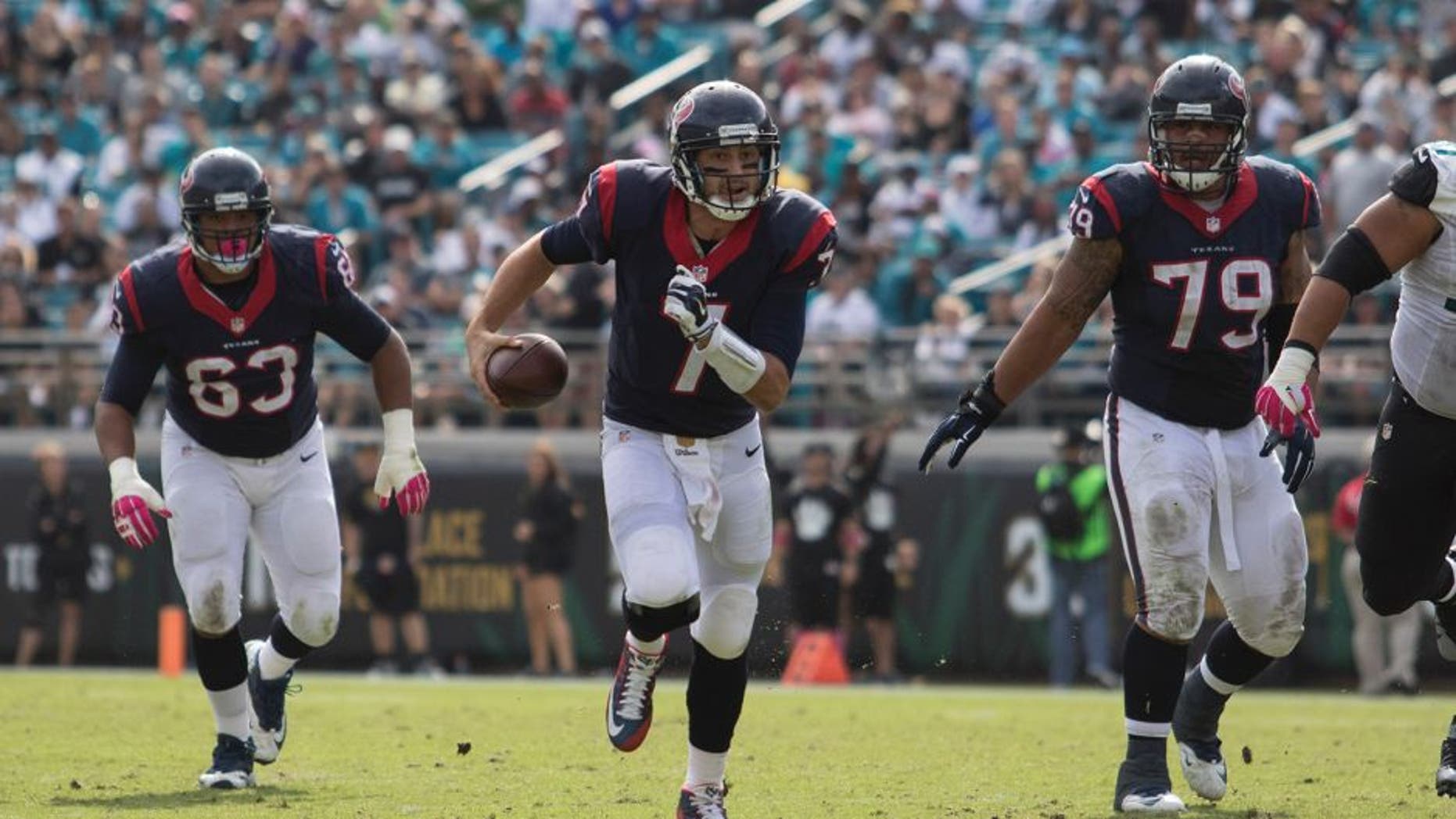 Oct 18, 2015; Jacksonville, FL, USA; Houston Texans quarterback Brian Hoyer (7) runs for a first down in the fourth quarter against the Jacksonville Jaguars at EverBank Field. The Houston Texans won 31-20. Mandatory Credit: Logan Bowles-USA TODAY Sports