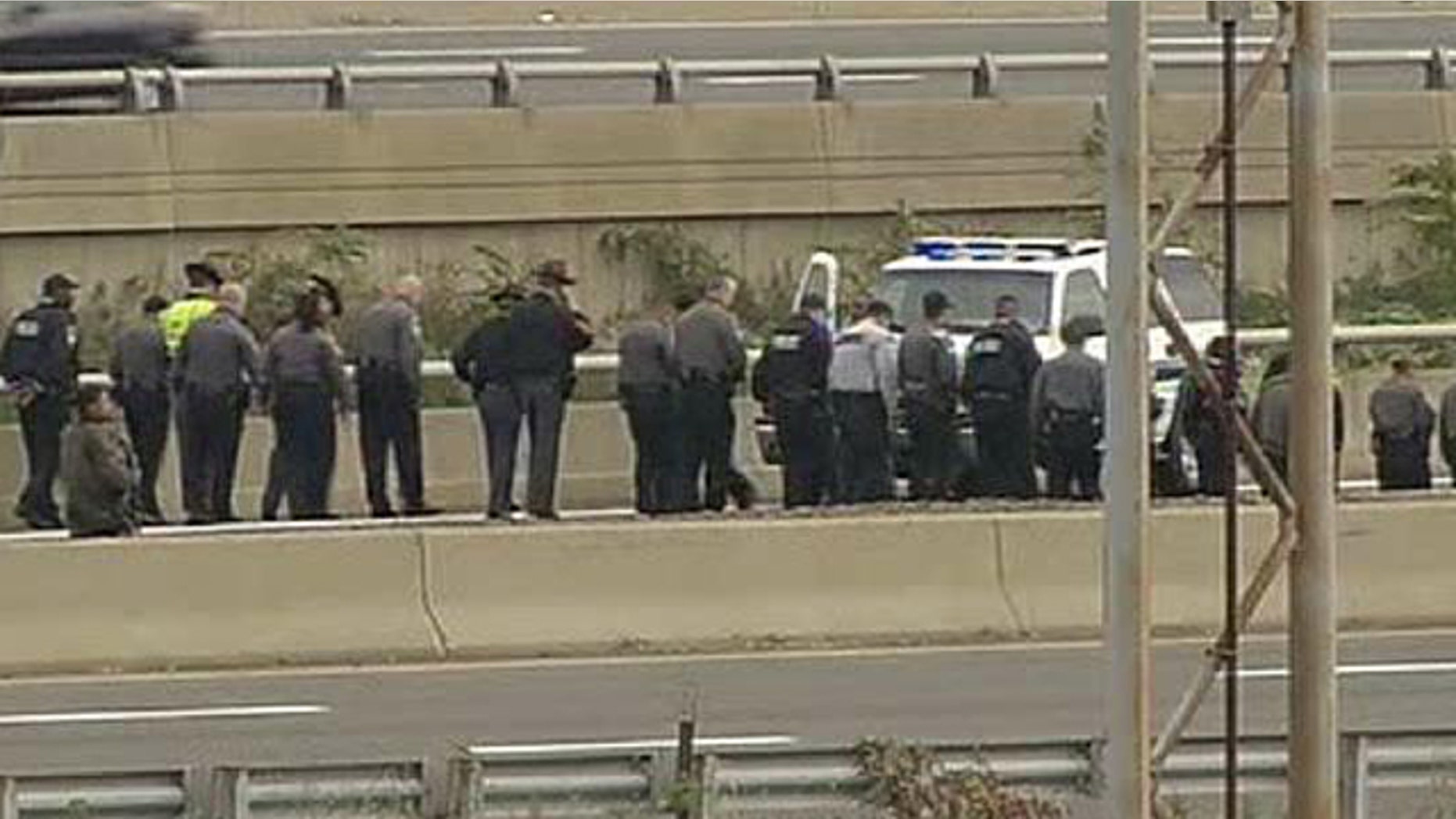 Oct. 19: Law Enforcement Officers search for evidence along the I-395 expressway adjacent to the Pentagon (Fox News).