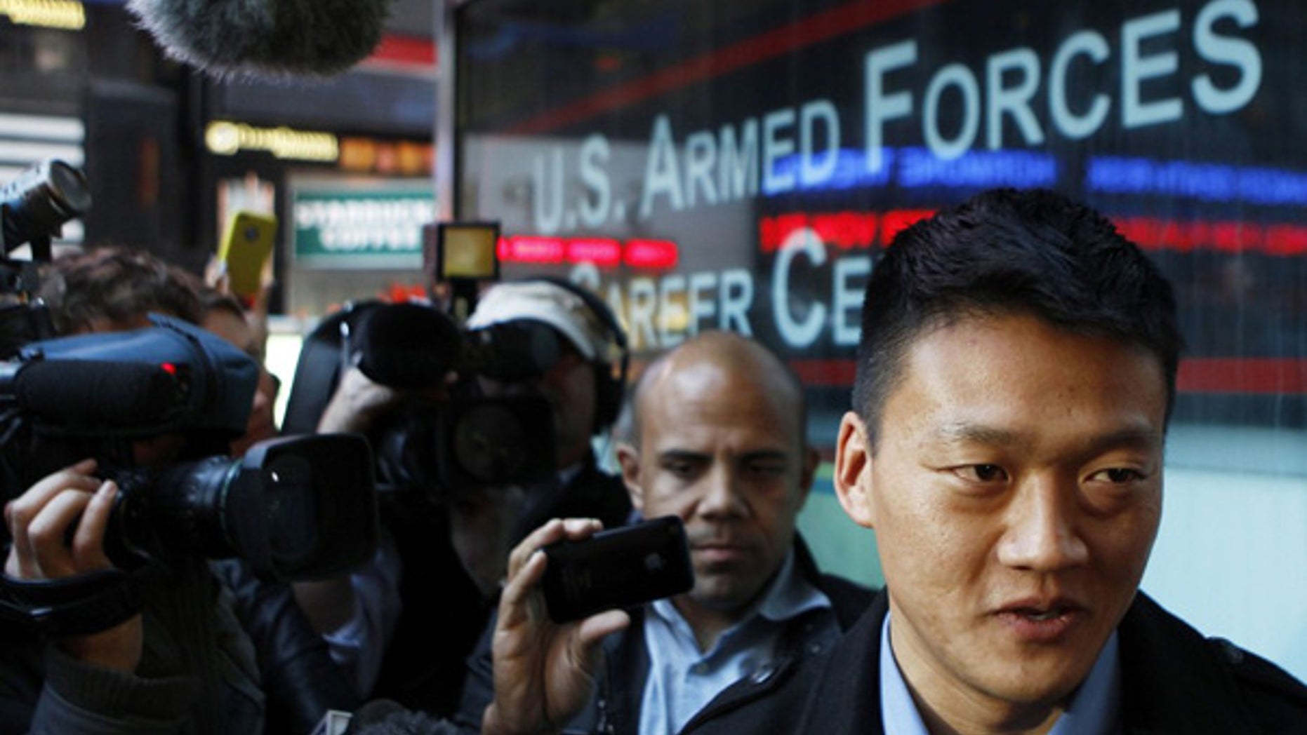 Oct. 19: Discharged U.S. Army Lt. Daniel Choi speaks with the media outside after attempting to re-enlist at the Times Square military recruitment station in New York.