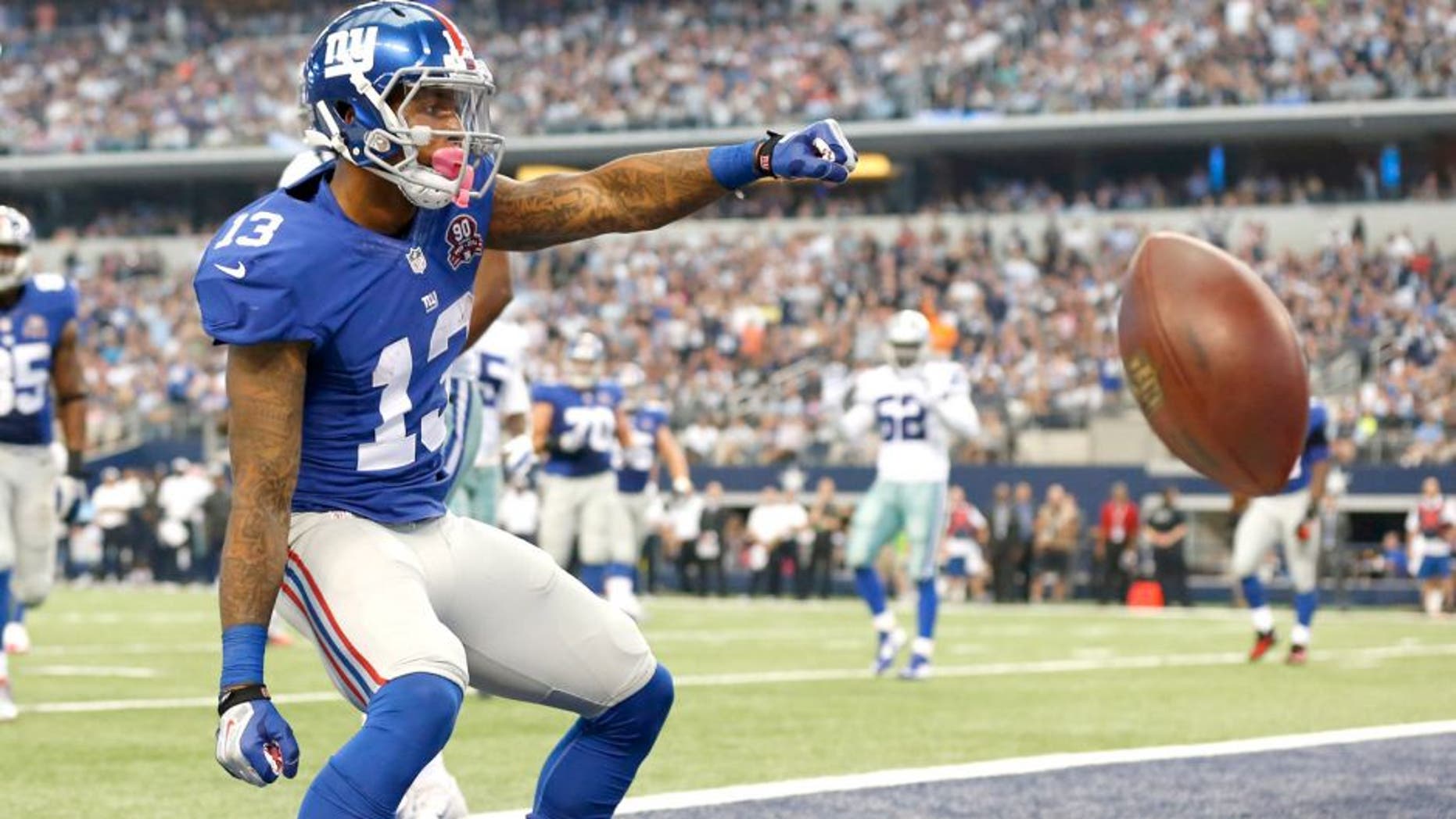 Oct 19, 2014; Arlington, TX, USA; New York Giants wide receiver Odell Beckham Jr. (13) celebrates his second quarter touchdown against the Dallas Cowboys at AT&T Stadium. Mandatory Credit: Matthew Emmons-USA TODAY Sports