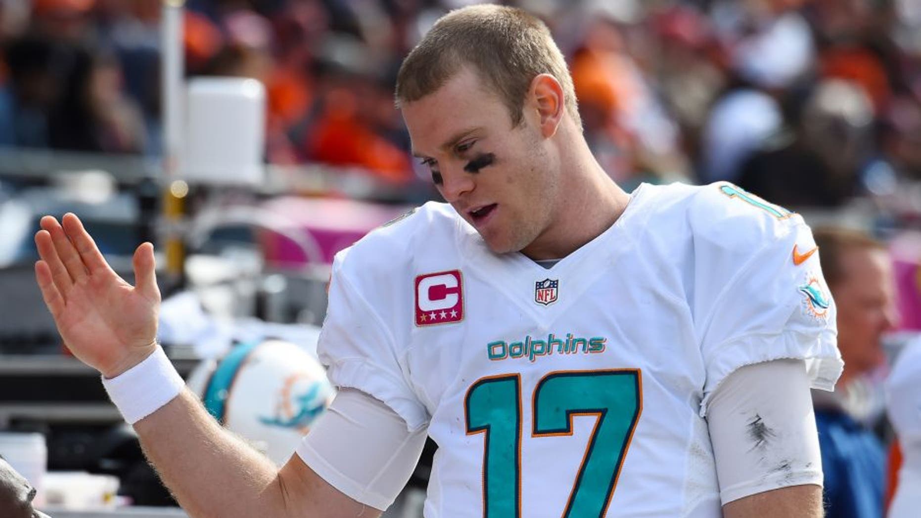 Oct 19, 2014; Chicago, IL, USA; Miami Dolphins quarterback Ryan Tannehill (17) reacts on the sidelines during the second half at Soldier Field. Miami Dolphins defeat the Chicago Bears 27-14. Mandatory Credit: Mike DiNovo-USA TODAY Sports