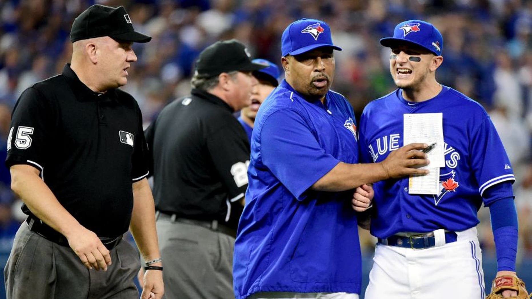 TORONTO, ON - OCTOBER 19: Troy Tulowitzki #2 of the Toronto Blue Jays reacts as he is ejected from the game in the eighth inning against the Kansas City Royals during game three of the American League Championship Series at Rogers Centre on October 19, 2015 in Toronto, Canada. (Photo by Harry How/Getty Images)