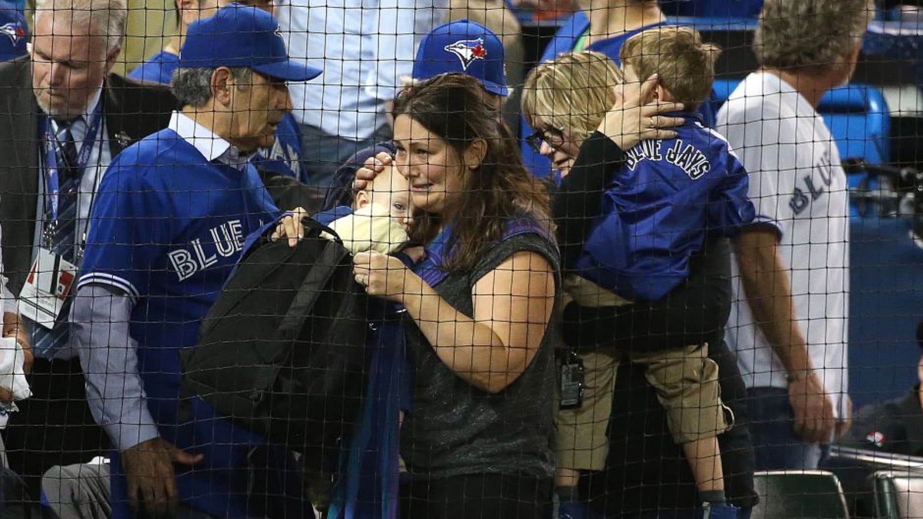 TORONTO, ON- OCTOBER 14: An infant was allegedly hit by a beer can during the protest. The Toronto Blue Jays and Texas Rangers play game four of the MLB American League Division Series . at Rogers Centre in Toronto. October 14, 2015. (Steve Russell/Toronto Star via Getty Images)