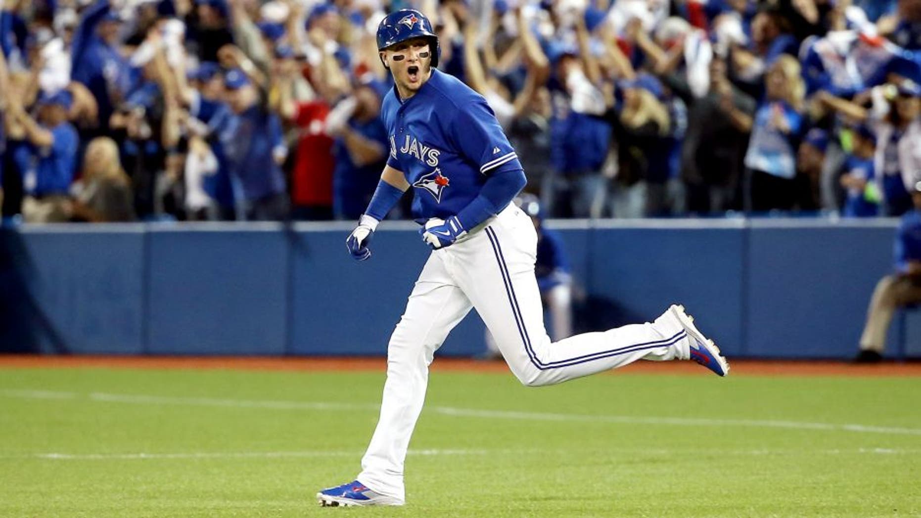 TORONTO, ON - OCTOBER 19: Troy Tulowitzki #2 of the Toronto Blue Jays runs the bases after hitting a three-run home run in the third inning against the Kansas City Royals during game three of the American League Championship Series at Rogers Centre on October 19, 2015 in Toronto, Canada. (Photo by Tom Szczerbowski/Getty Images)