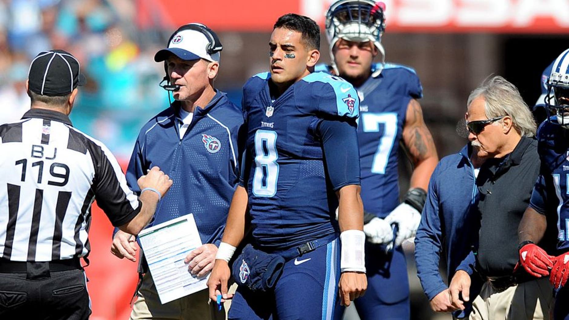 Oct 18, 2015; Nashville, TN, USA; Tennessee Titans quarterback Marcus Mariota (8) is helped off the field after an injury during the first half against the Miami Dolphins at Nissan Stadium. Mandatory Credit: Christopher Hanewinckel-USA TODAY Sports