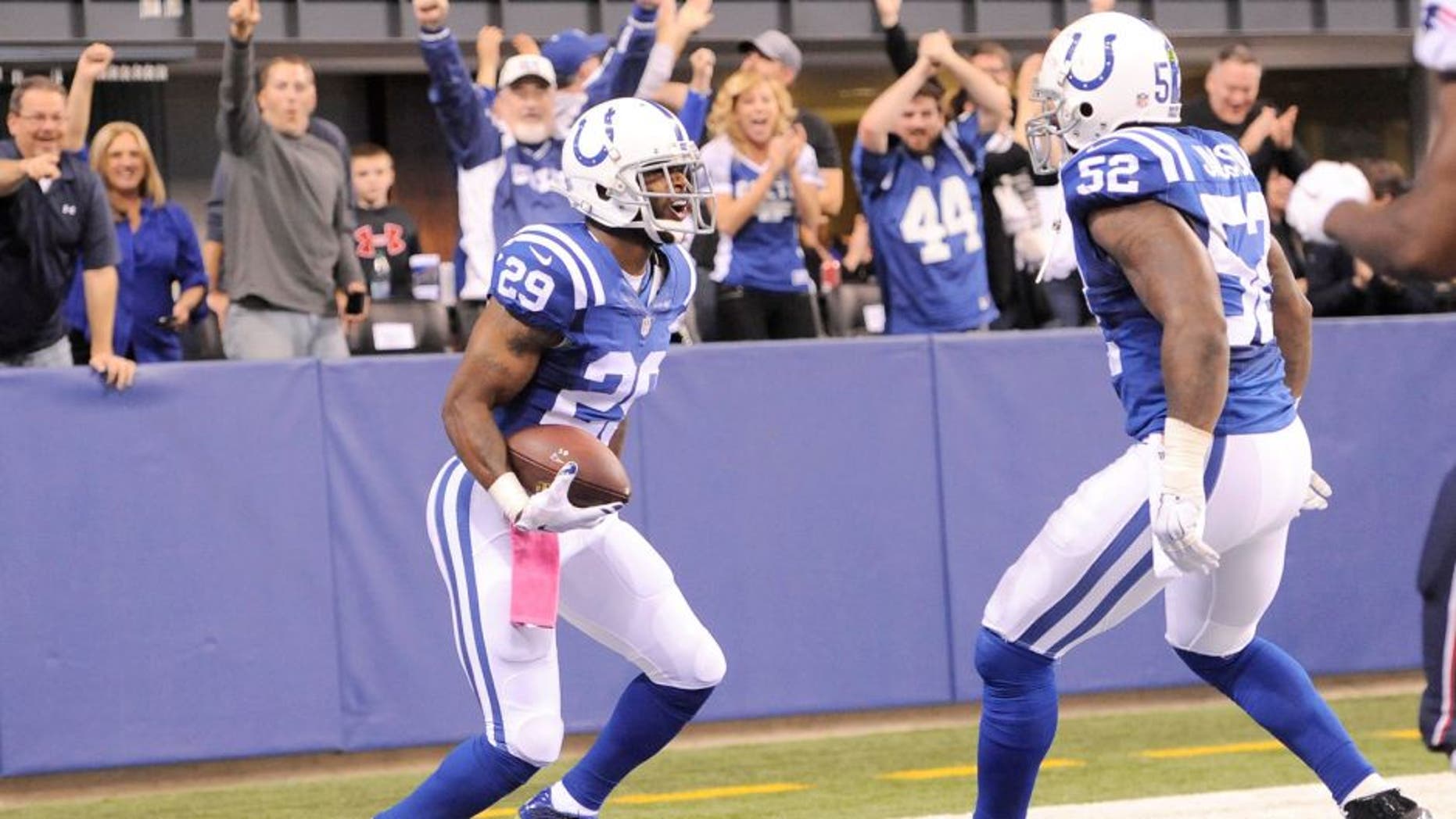 Oct 18, 2015; Indianapolis, IN, USA; Indianapolis Colts strong safety Mike Adams (29) celebrates with inside linebacker D'Qwell Jackson (52) after returning an interception for a touchdown against the New England Patriots in the first half during the NFL game at Lucas Oil Stadium. Mandatory Credit: Thomas J. Russo-USA TODAY Sports