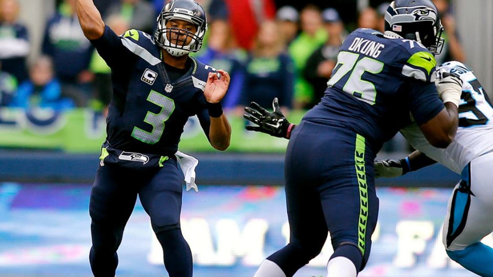 SEATTLE, WA - OCTOBER 18: Quarterback Russell Wilson #3 of the Seattle Seahawks throws the ball against the Carolina Panthers at CenturyLink Field on October 18, 2015 in Seattle, Washington. (Photo by Jonathan Ferrey/Getty Images)