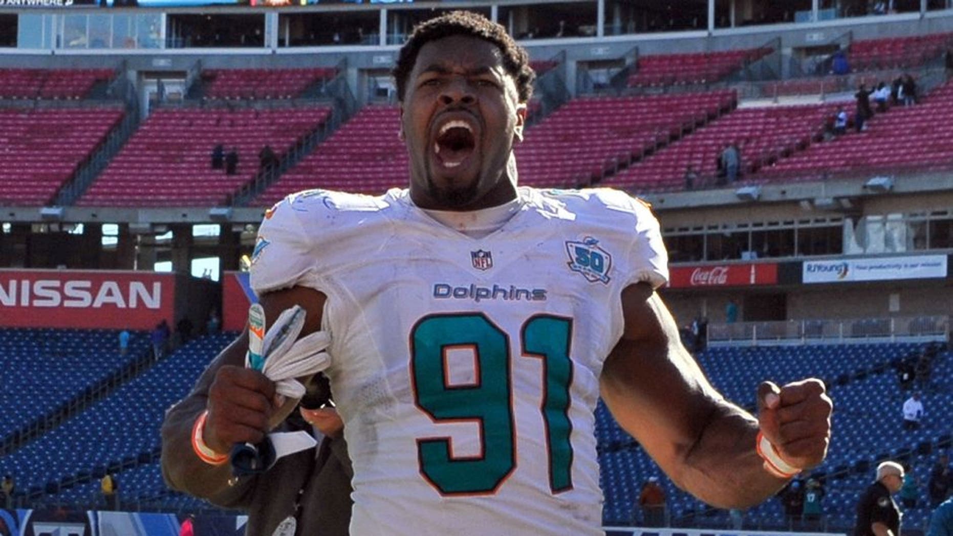 Oct 18, 2015; Nashville, TN, USA; Miami Dolphins defensive end Cameron Wake (91) celebrates as he leaves the field after his team defeated the Tennessee Titans during the second half at Nissan Stadium. Miami won 38-10. Mandatory Credit: Jim Brown-USA TODAY Sports