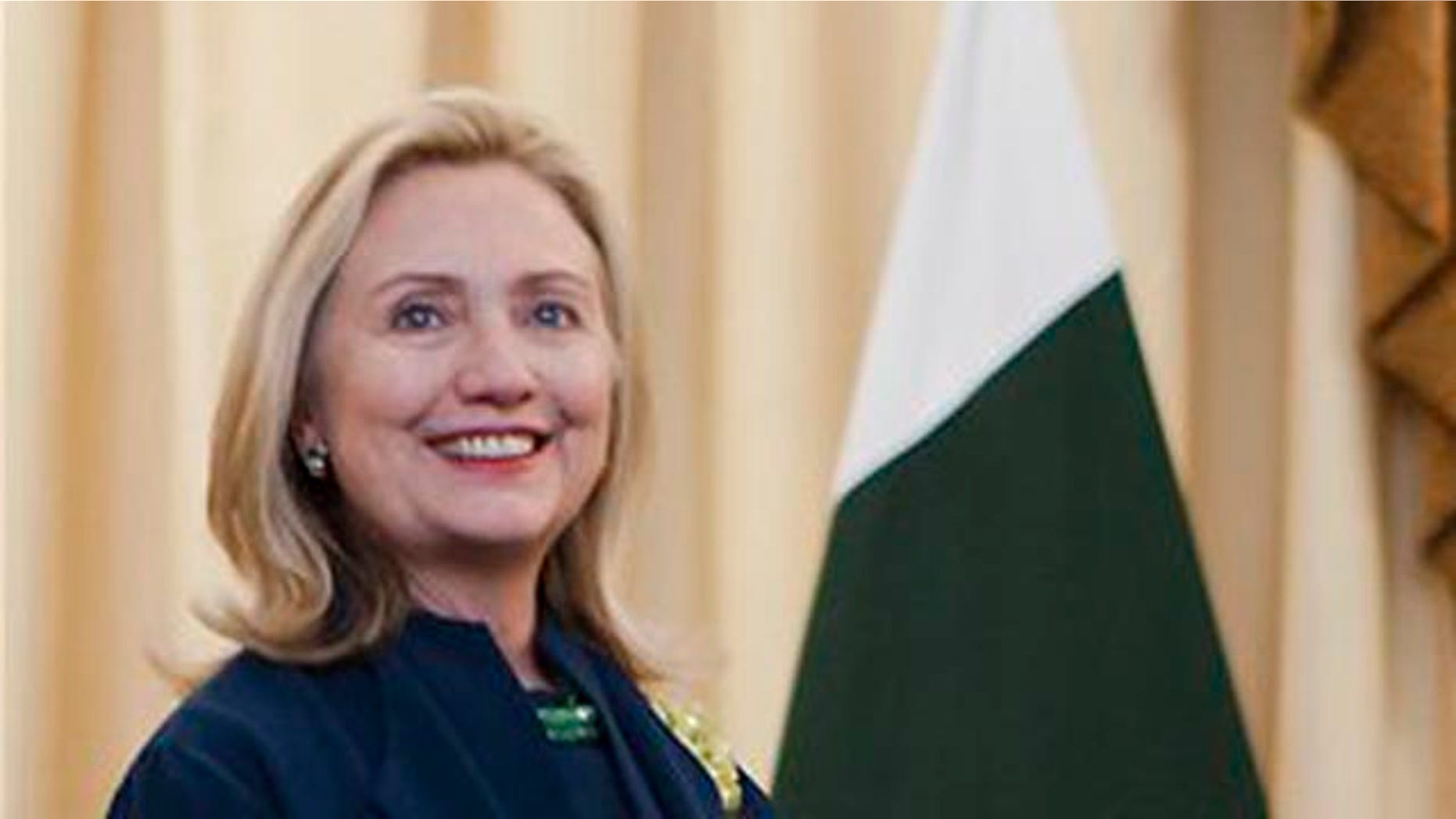 October 20, 2011: U.S. Secretary of State Hillary Rodham Clinton smiles while she waits to Pakistani Prime Minister Yousuf Raza Gilani for their meeting in Islamabad, Pakistan.