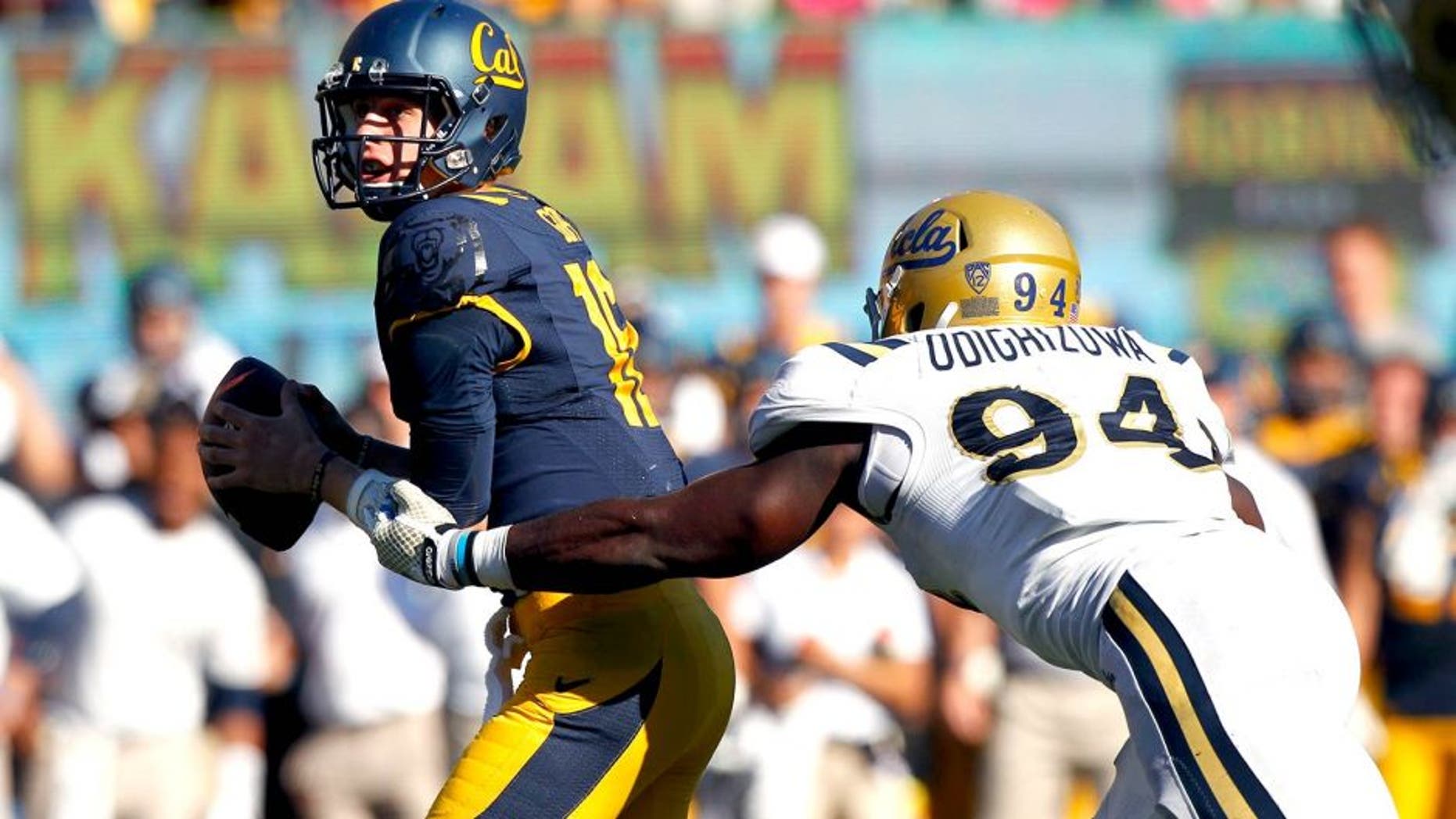 Oct 18, 2014; Berkeley, CA, USA; California Golden Bears quarterback Jared Goff (16) is unable to elude UCLA Bruins defensive lineman Owamagbe Odighizuwa (94) in the fourth quarter at Memorial Stadium. The Bruins defeated the Golden Bears 36-34. Mandatory Credit: Cary Edmondson-USA TODAY Sports