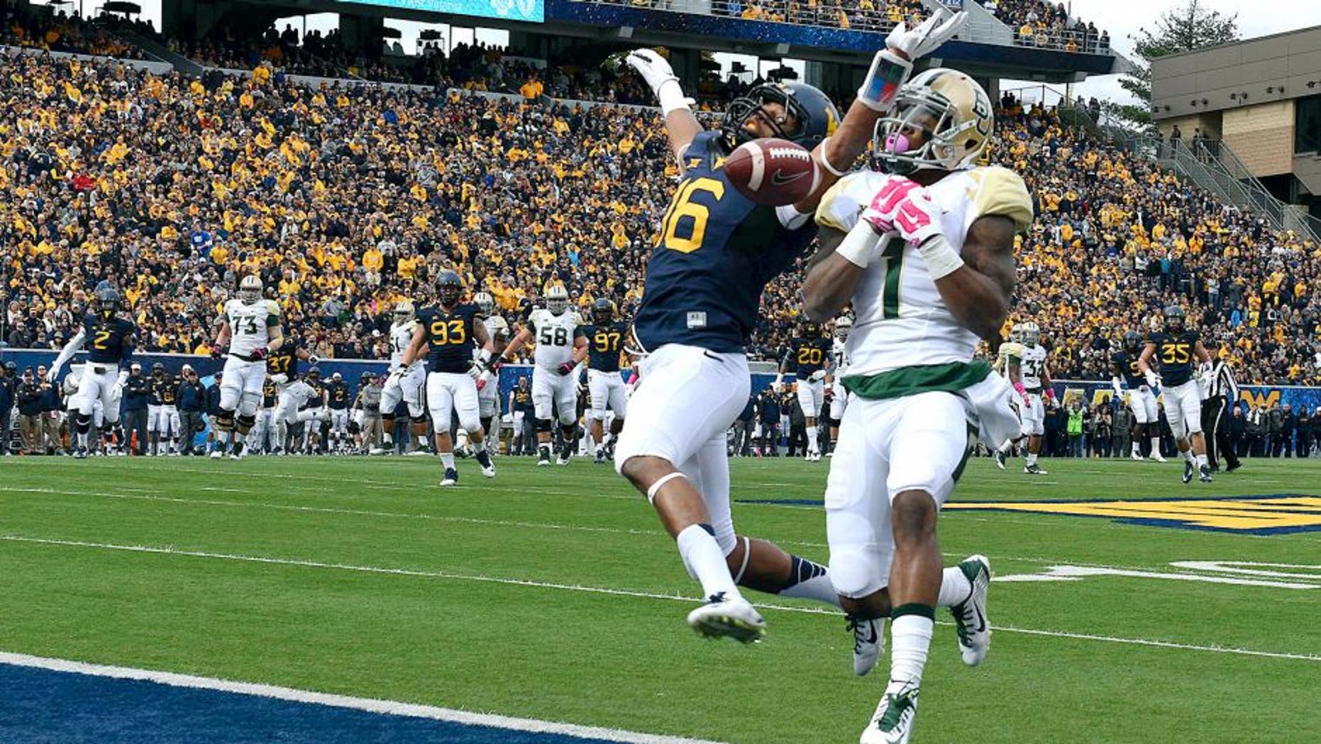Oct 18, 2014; Morgantown, WV, USA; West Virginia Mountaineers cornerback Terrell Chestnut (16) breaks up a intended pass to Baylor Bears running back Corey Coleman (1) on the goal line during the first quarter at Milan Puskar Stadium. Mandatory Credit: Tommy Gilligan-USA TODAY Sports