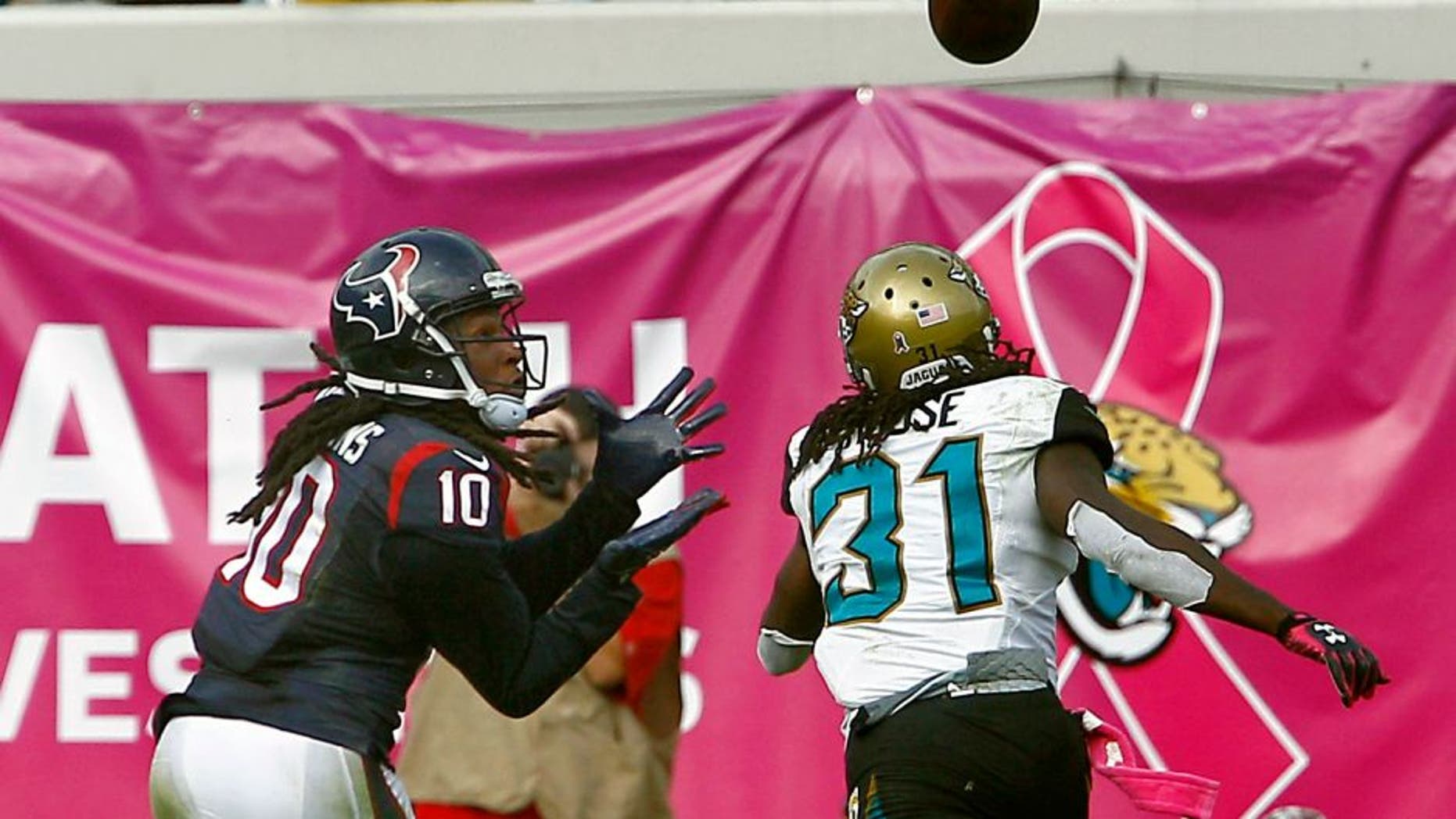 Oct 18, 2015; Jacksonville, FL, USA; Houston Texans wide receiver DeAndre Hopkins (10) makes a touchdown catch over Jacksonville Jaguars cornerback Davon House (31) during the second half of a football game at EverBank Field. Houston won 31-20. Mandatory Credit: Reinhold Matay-USA TODAY Sports