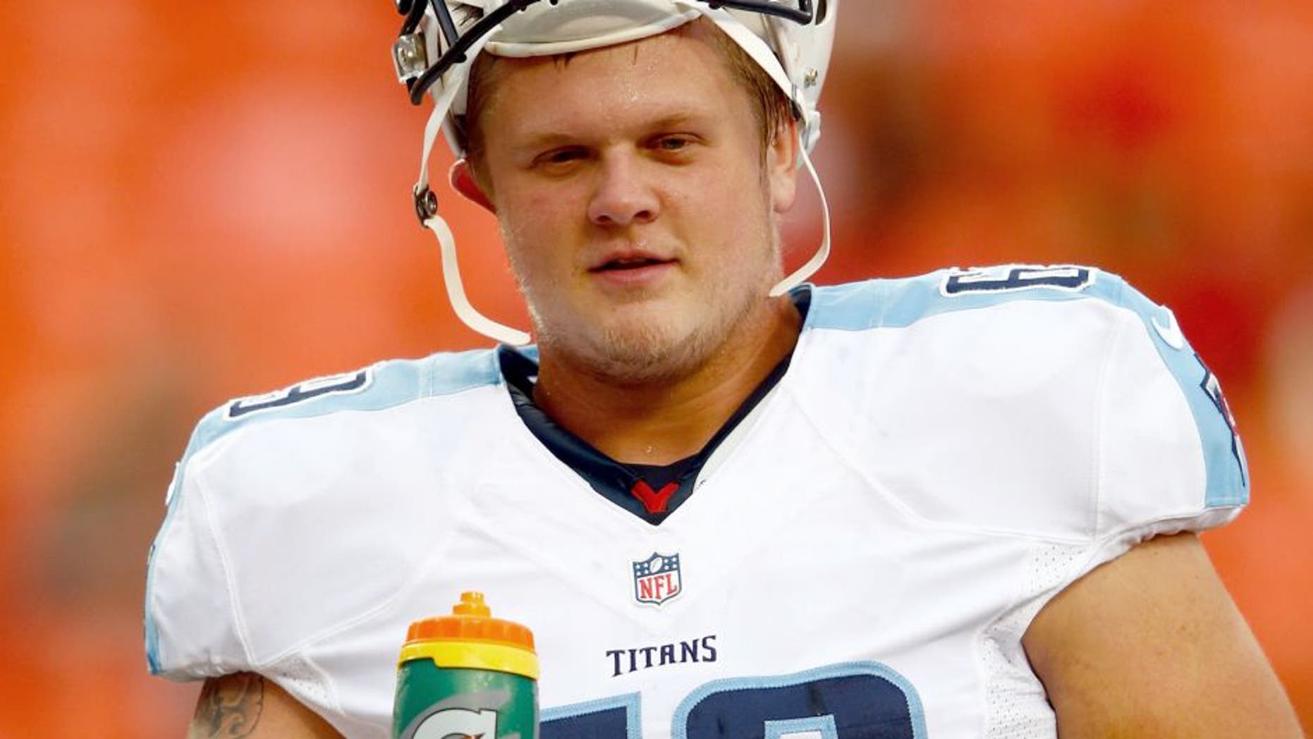 KANSAS CITY, MO - AUGUST 28: Center Andy Gallik #69 of the Tennessee Titans warms up prior to the preseason game against the Kansas City Chiefs at Arrowhead Stadium on August 28, 2015 in Kansas City, Missouri. (Photo by Jamie Squire/Getty Images)