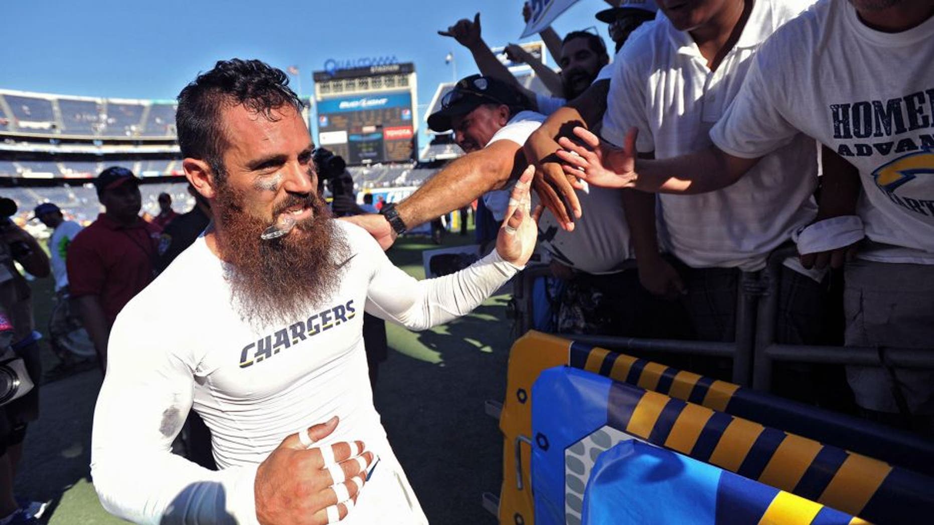 Sep 13, 2015; San Diego, CA, USA; San Diego Chargers free safety Eric Weddle (left) thanks the fans after the game against the Detroit Lions at Qualcomm Stadium. San Diego won 33-28. Mandatory Credit: Orlando Ramirez-USA TODAY Sports