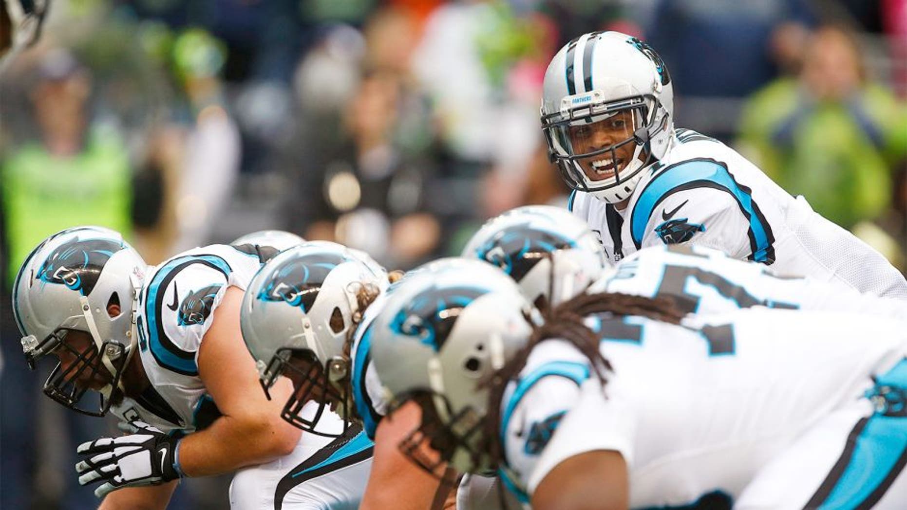 Oct 18, 2015; Seattle, WA, USA; Carolina Panthers quarterback Cam Newton (1) stands over center against the Seattle Seahawks during the third quarter at CenturyLink Field. Carolina defeated Seattle, 27-23. Mandatory Credit: Joe Nicholson-USA TODAY Sports