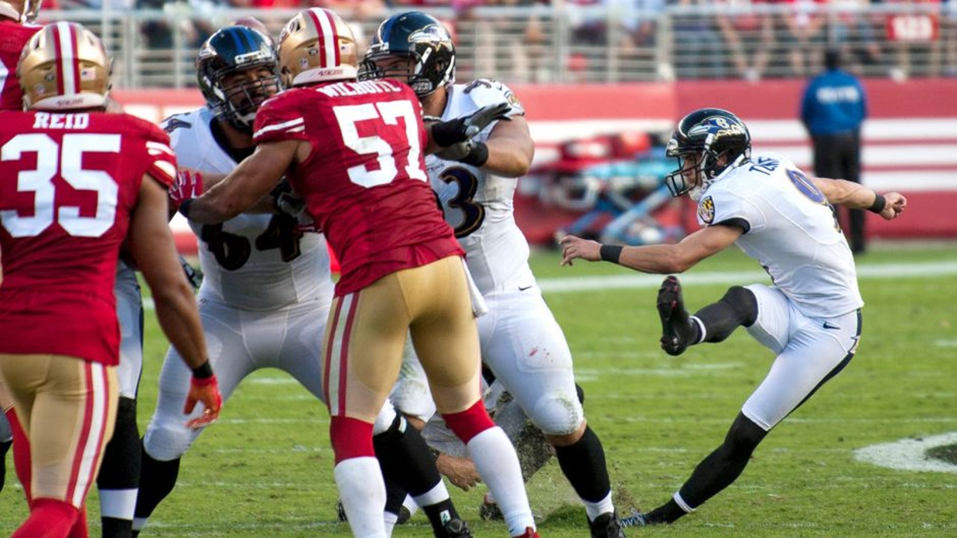Oct 18, 2015; Santa Clara, CA, USA; Baltimore Ravens kicker Justin Tucker (9) slips as he attempts a field goal during the third quarter of the game against the San Francisco 49ers at Levi's Stadium. The 49ers defeated the Ravens 25-20. Mandatory Credit: Ed Szczepanski-USA TODAY Sports