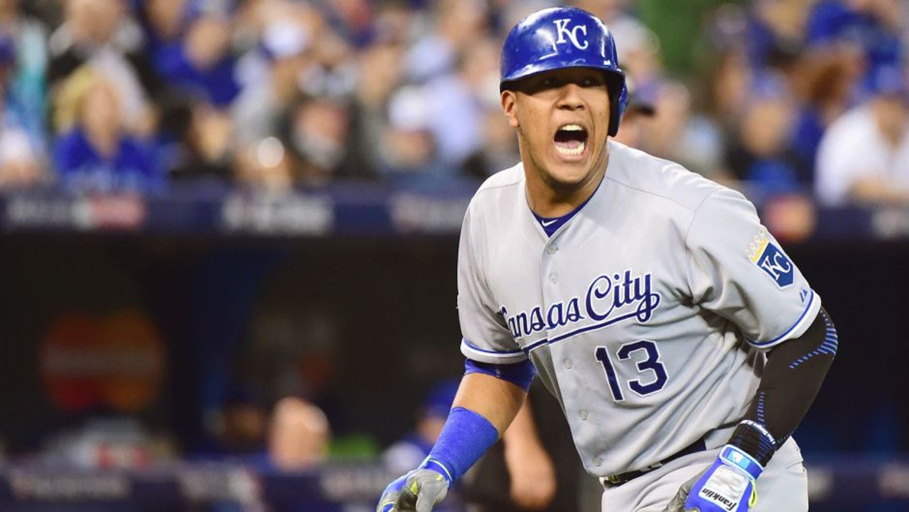 Salvador Perez #13 of the Kansas City Royals reacts after scoring a run in the seventh inning against the Toronto Blue Jays during game four of the American League Championship Series at Rogers Centre on October 20, 2015 in Toronto, Canada. (Photo by Harry How/Getty Images)