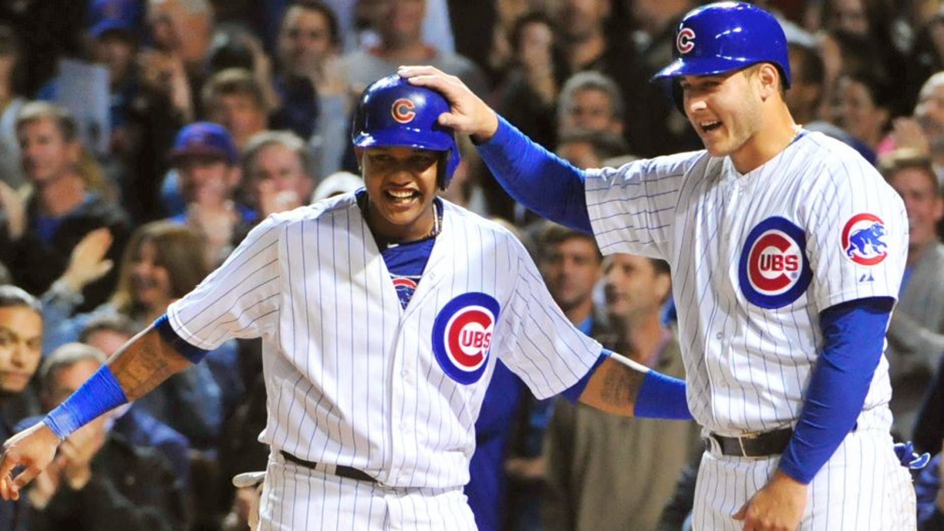 Starlin Castro (L) of the Chicago Cubs and Anthony Rizzo (R) celebrate a Jorge Soler #68 three-run home run against the Milwaukee Brewers during the seventh inning on September 21, 2015 at Wrigley Field in Chicago, Illinois. (Photo by David Banks/Getty Images)