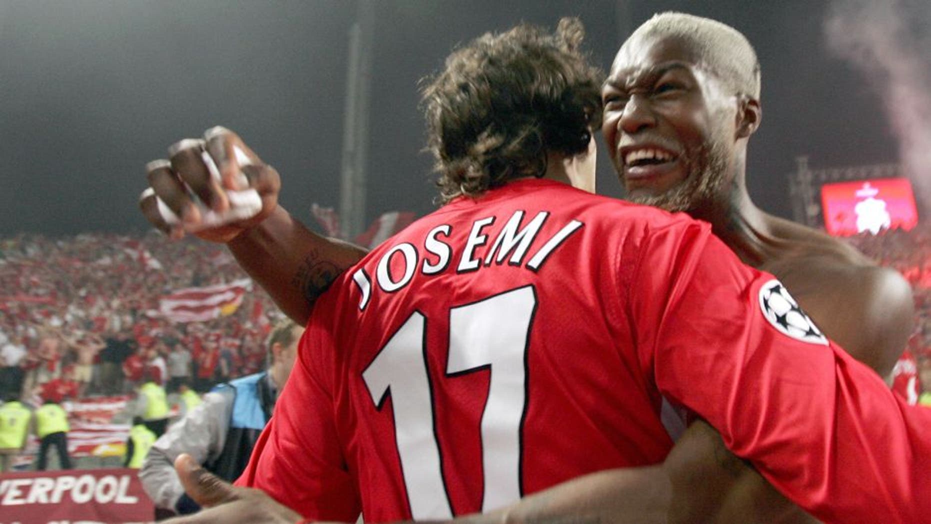 Istanbul, Turkey: Liverpool's Spanish Defender Josemi Jesemi and Liverpool's French striker Djibril Cisse celebrate after winning at the UEFA Champions league football final AC Milan vs Liverpool, 25 May 2005 at the Ataturk Stadium in Istanbul. Liverpool won 3-2 on penalties. AFP PHOTO FILIPPO MONTEFORTE (Photo credit should read FILIPPO MONTEFORTE/AFP/Getty Images)