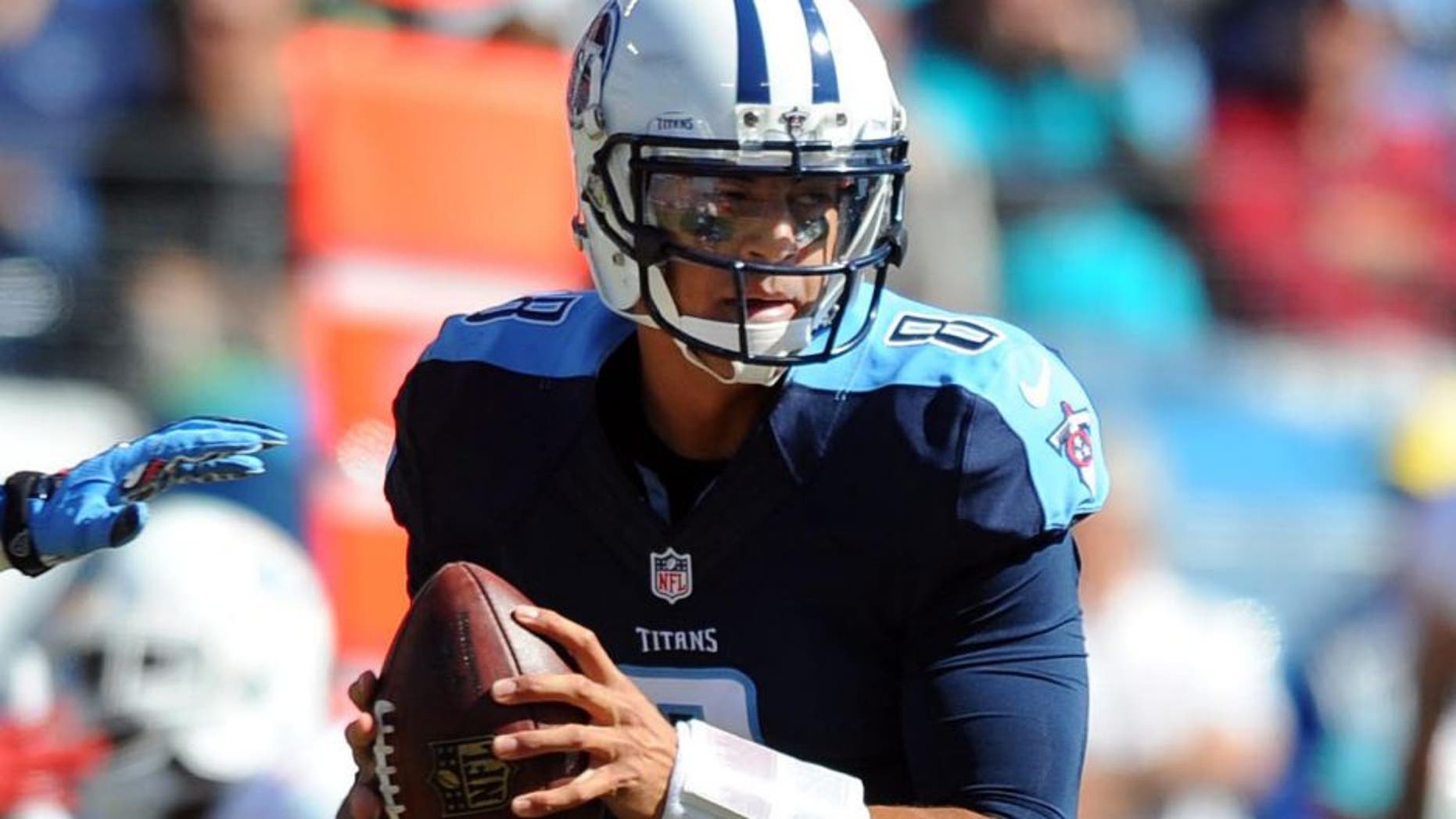 Oct 18, 2015; Nashville, TN, USA; Tennessee Titans quarterback Marcus Mariota (8) drops back to pass during the first half against the Miami Dolphins at Nissan Stadium. Mandatory Credit: Christopher Hanewinckel-USA TODAY Sports