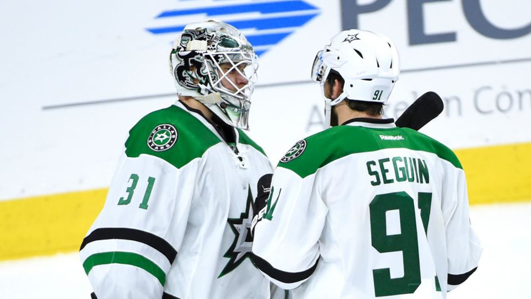 Oct 20, 2015; Philadelphia, PA, USA; Dallas Stars goalie Antti Niemi (31) and center Tyler Seguin (91) celebrate the win against the Philadelphia Flyers at Wells Fargo Center. The Stars defeated the Flyers, 2-1. Mandatory Credit: Eric Hartline-USA TODAY Sports