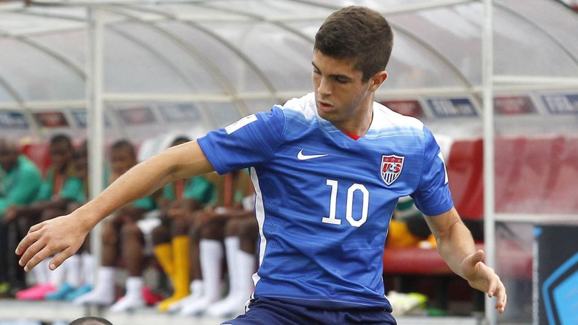 US player Christian Pulisic (R) and Nigeria's John Lazaru (L) vie the ball during an Under 17 World Cup football match between Nigeria and the United States at the Estadio Nacional in Santiago on October 17, 2015. AFP PHOTO/MARCELO HERNANDEZ/PHOTOSPORT (Photo credit should read MARCELO HERNANDEZ/AFP/Getty Images)