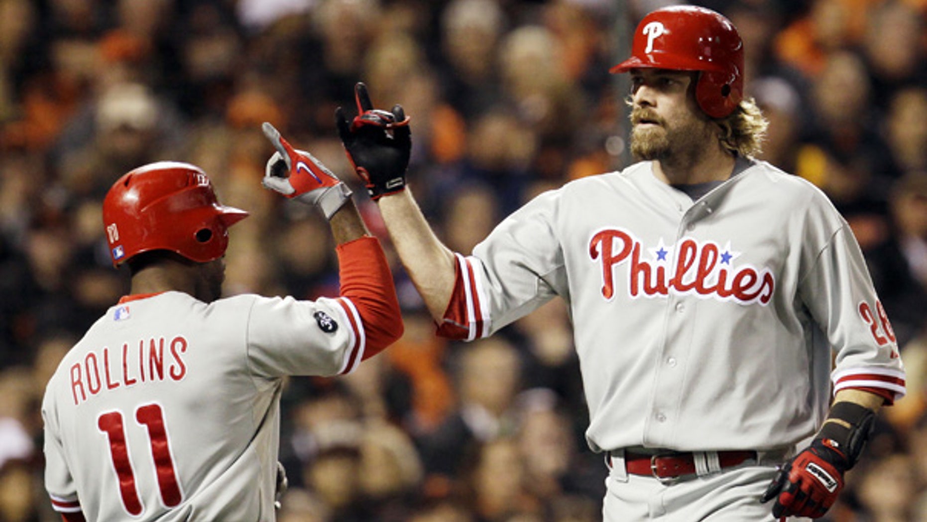 Oct. 21: Philadelphia Phillies' Jayson Werth, right, is congratulated by Jimmy Rollins after Werth hit a home run during the ninth inning in San Francisco.