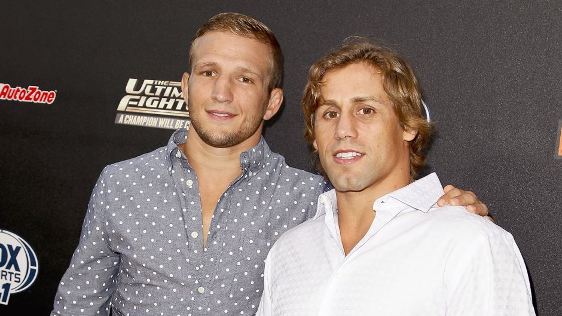 HOLLYWOOD, CA - SEPTEMBER 09: (L-R) TJ Dillashaw and Urijah Faber attend FOX Sports 1's 'The Ultimate Fighter' season premiere party at Lure on September 9, 2014 in Hollywood, California. (Photo by Tibrina Hobson/WireImage)