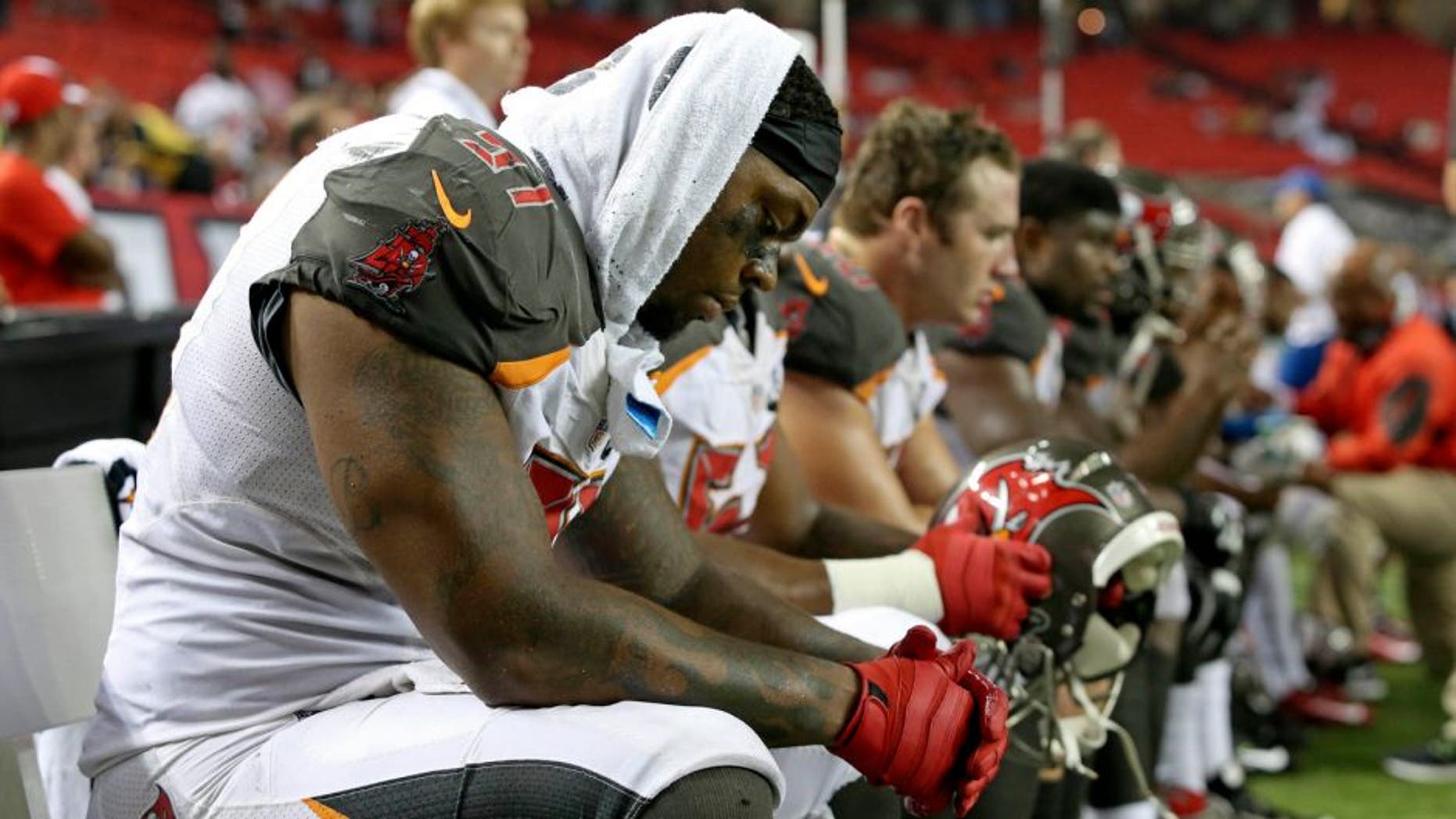 Sep 18, 2014; Atlanta, GA, USA; Tampa Bay Buccaneers defensive end Da'Quan Bowers (91) reacts on the sideline during their loss to the Atlanta Falcons in the fourth quarter at the Georgia Dome. The Falcons won 56-14. Mandatory Credit: Jason Getz-USA TODAY Sports