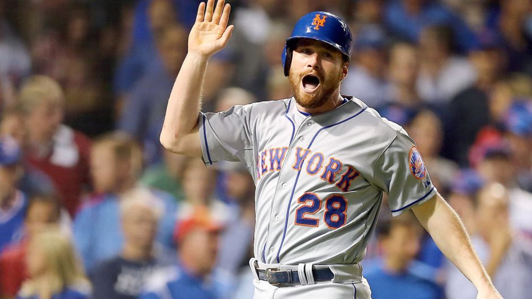 CHICAGO, IL - OCTOBER 21: Daniel Murphy #28 of the New York Mets celebrates after scoring off of a double hit by Lucas Duda #21 of the New York Mets in the second inning against Travis Wood #37 of the Chicago Cubs during game four of the 2015 MLB National League Championship Series at Wrigley Field on October 21, 2015 in Chicago, Illinois. (Photo by Elsa/Getty Images)