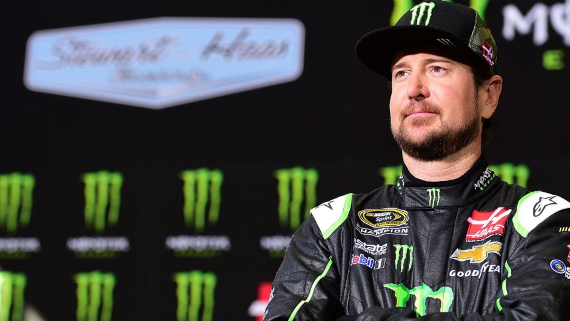 KANNAPOLIS, NC - OCTOBER 21: Kurt Busch, driver of the #41 Stewart-Haas Racing Chevrolet, looks on during a press conference announcing Monster Energy as a co-sponsor on the #41 Stewart-Haas Racing Chevrolet at Stewart-Haas Racing on October 21, 2015 in Kannapolis, North Carolina. Monster Energy will team with Busch for a multiyear deal which will include primary sponsorship (hood) for 17 races, secondary sponsorship (quarter panel) for 18 races, and one full primary race sponsorship. (Photo by Jared C. Tilton/Stewart-Haas Racing via Getty Images)