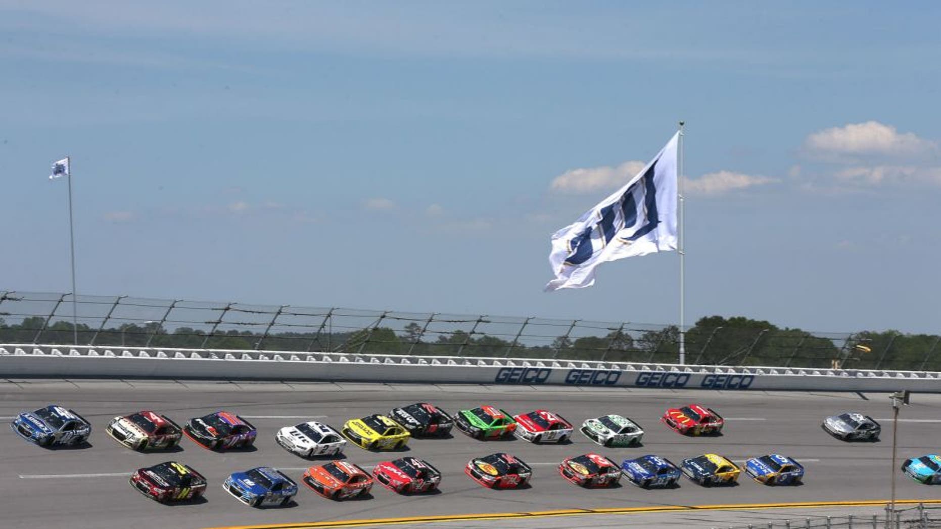 Jimmie Johnson, driver of the #48 Lowe's Chevrolet, and Jeff Gordon, driver of the #24 Drive To End Hunger Chevrolet, lead the field during the NASCAR Sprint Cup Series GEICO 500 at Talladega Superspeedway on May 3, 2015 in Talladega, Alabama.
