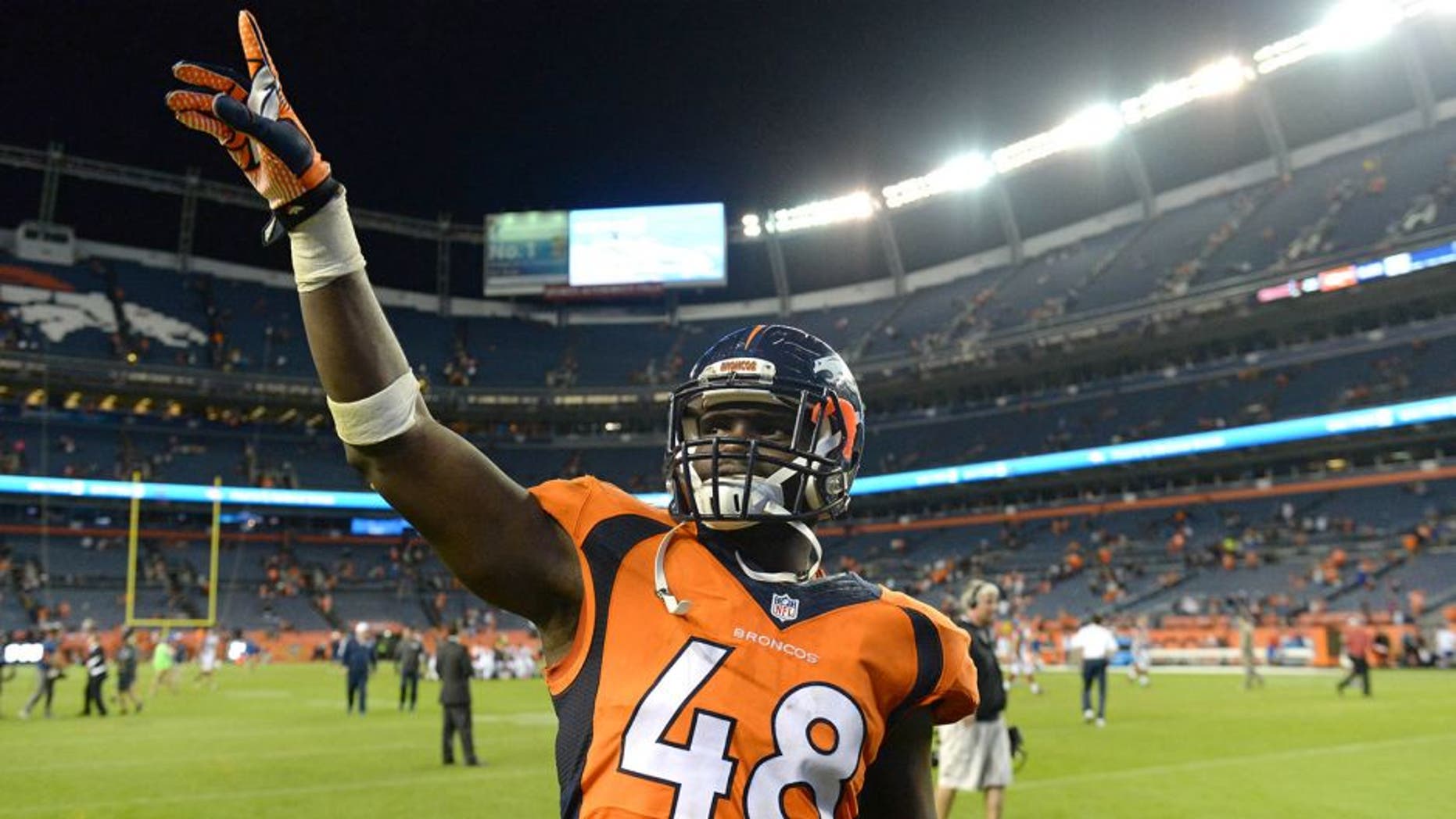 Sep 3, 2015; Denver, CO, USA; Denver Broncos linebacker Shaquil Barrett (48) leaves the field following the preseason loss to the Arizona Cardinals at Sports Authority Field at Mile High. The Cardinals defeated the Broncos 22-20. Mandatory Credit: Ron Chenoy-USA TODAY Sports