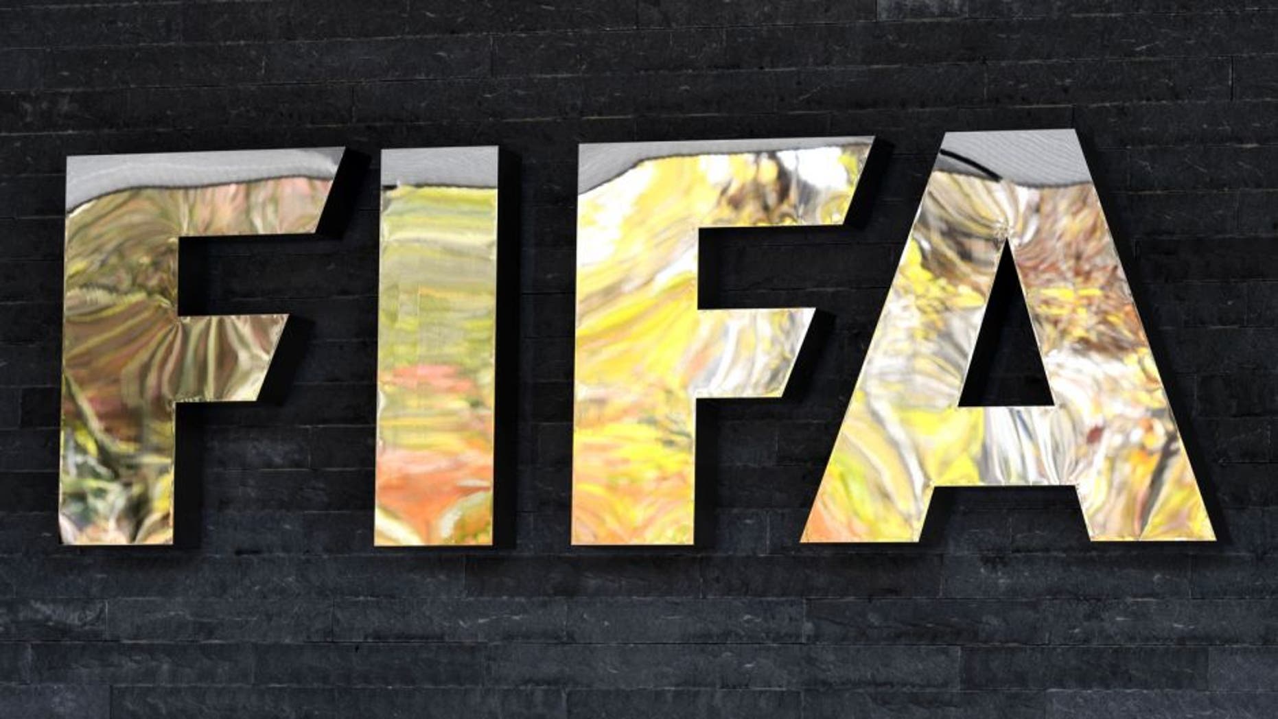 The FIFA sign is seen at the entrance of world football's governing body headquarters in Zurich on October 20, 2015. FIFA's reform committee on October 20 issued an interim report calling for "significant changes" to its structure and operations in order to restore the reputation of world football's governing body. AFP PHOTO / FABRICE COFFRINI (Photo credit should read FABRICE COFFRINI/AFP/Getty Images)